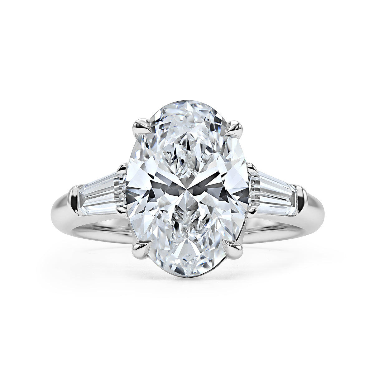 14K white gold three-stone ring with a 3.52 carat oval diamond and taper baguette side diamonds.