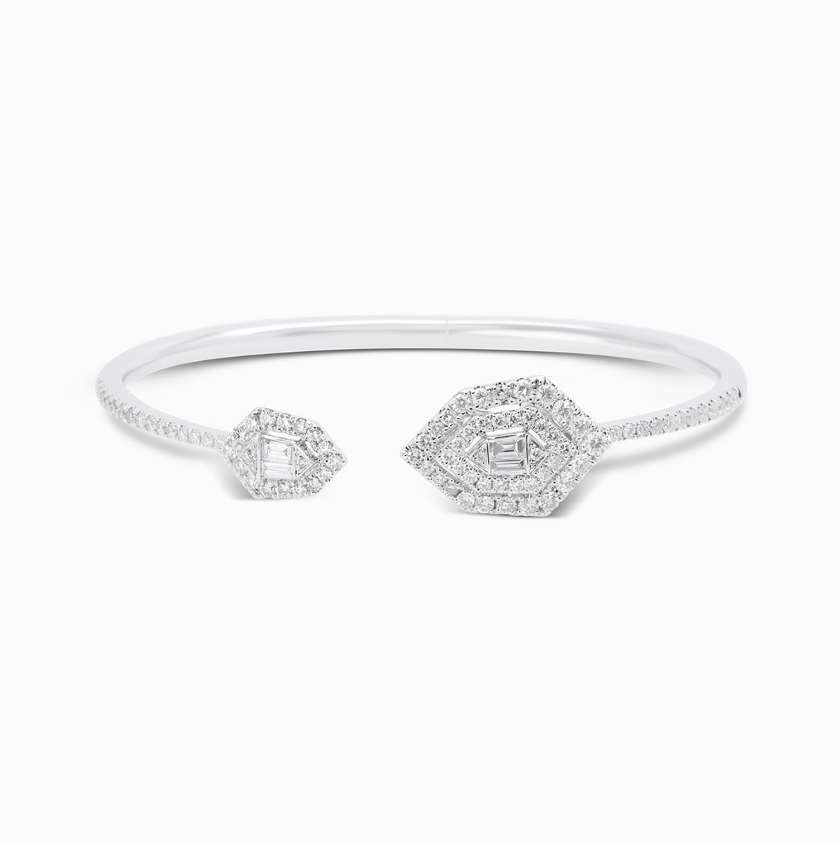 18K white gold open cuff featuring diamond-set pentagon arrow motifs in a modern geometric design.