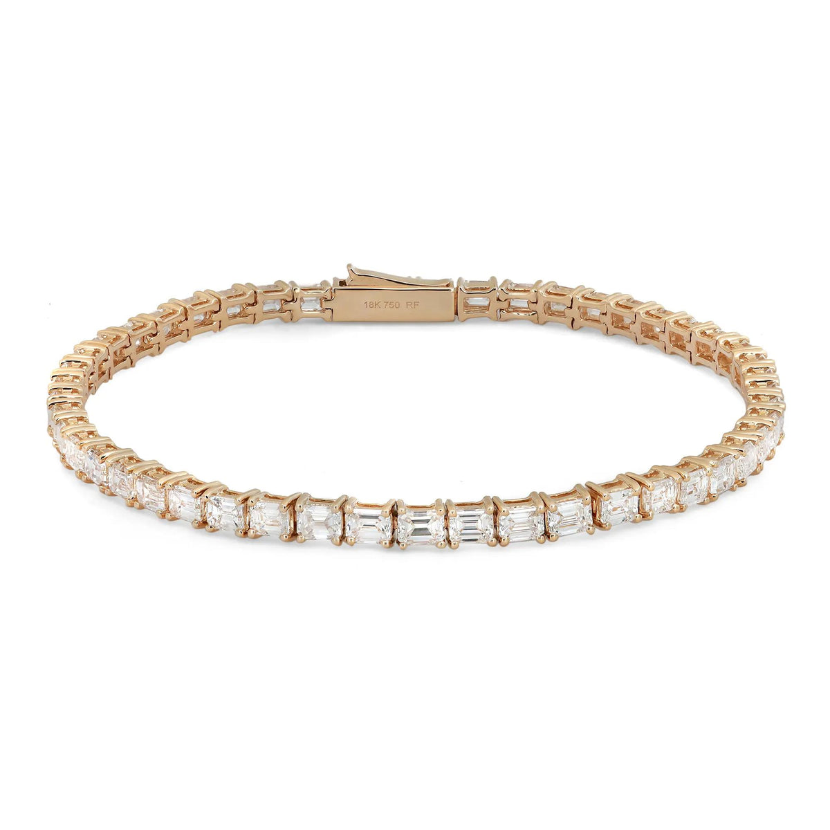 18K yellow gold east-west tennis bracelet featuring emerald cut diamonds totaling 7.00 carats in a sleek, elegant setting.