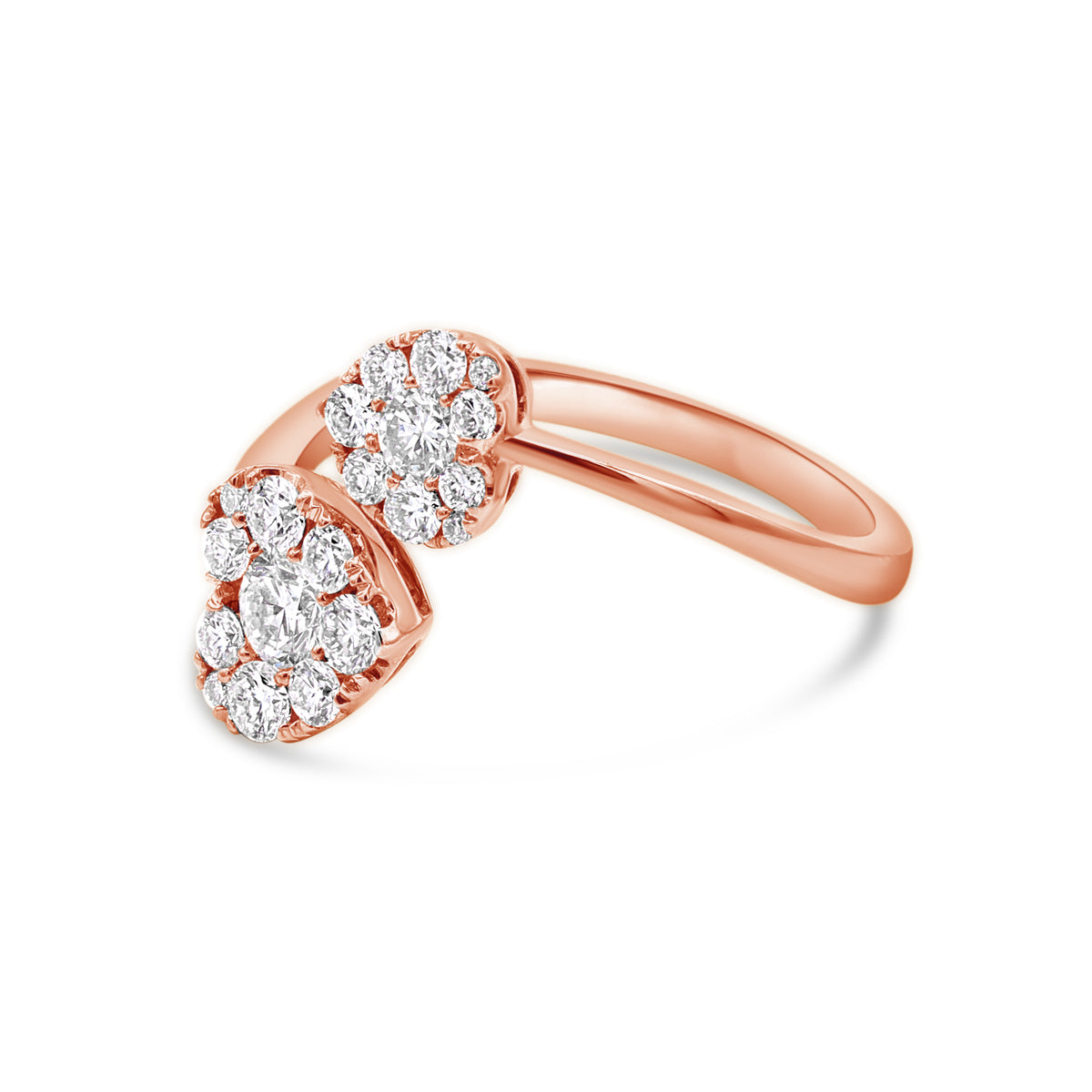 A rose gold ring with two heart-shaped main stones, surrounded by smaller round stones.