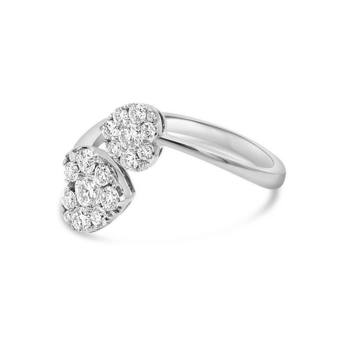 A white gold ring with two heart-shaped main stones, surrounded by smaller round stones.