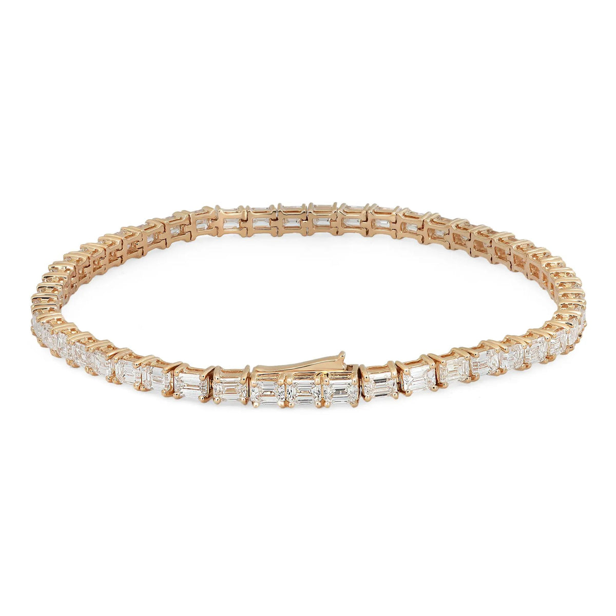 18K yellow gold tennis bracelet with east-west set emerald cut diamonds totaling 7.00 carats.