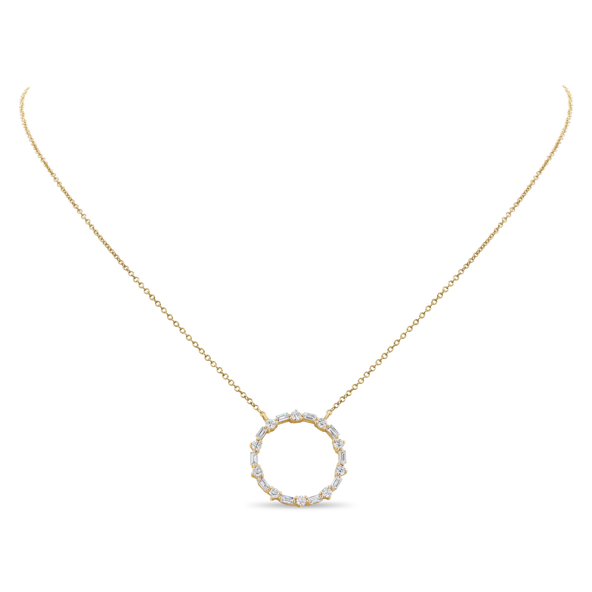 14K gold circle pendant featuring alternating baguette and round diamonds in a classic modern design.
