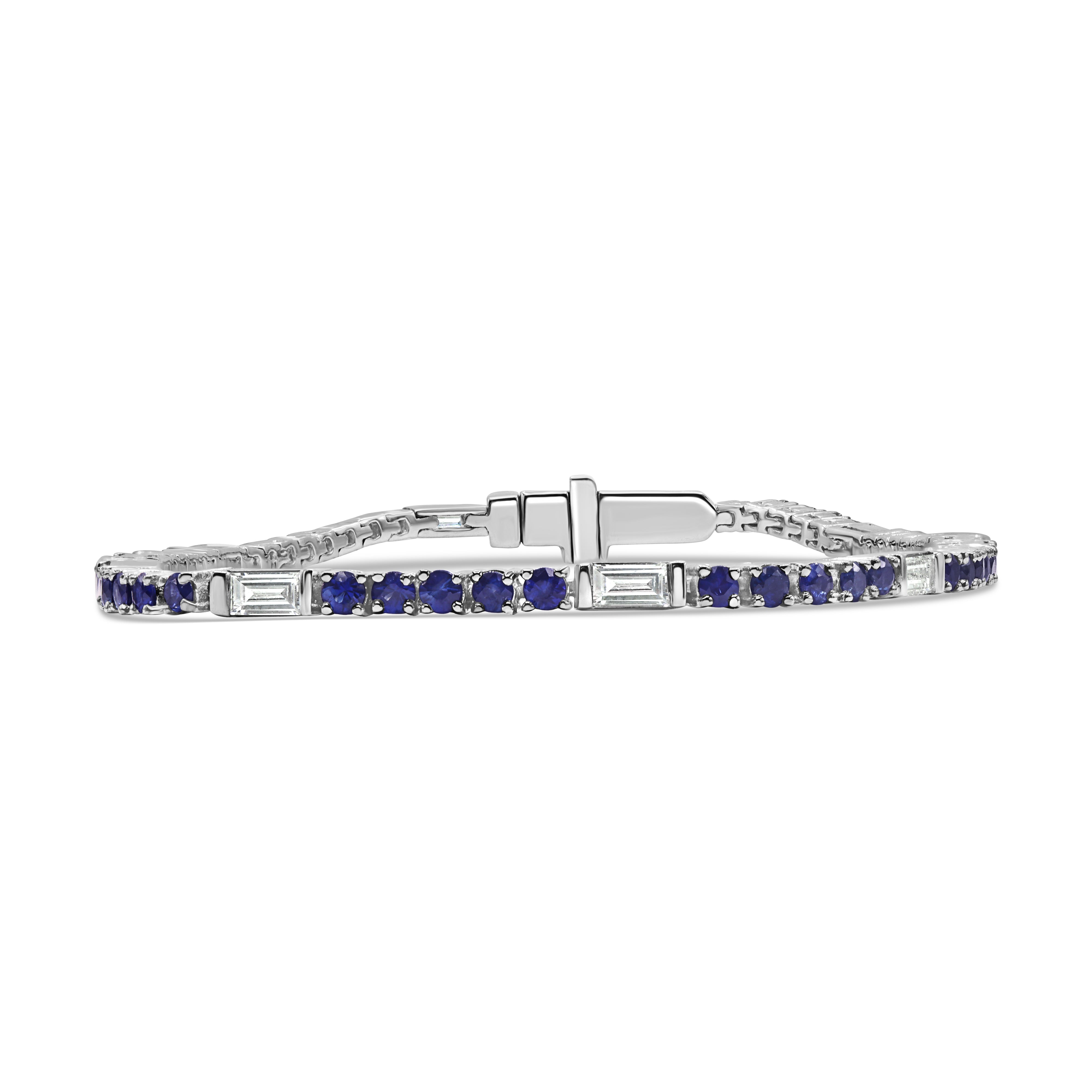14K gold tennis bracelet featuring alternating blue sapphires and baguette diamonds in a refined design.