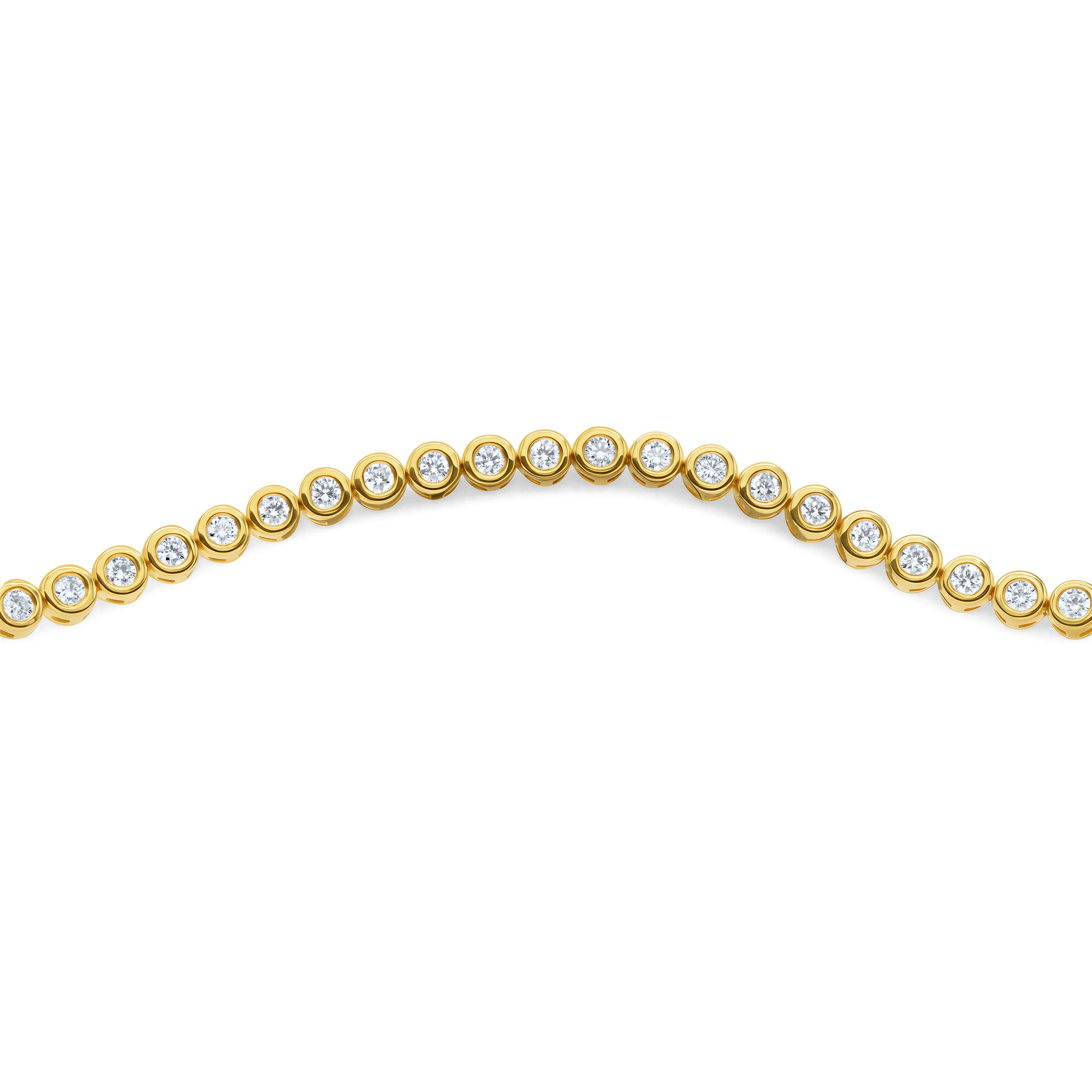 Bezel-set round cut diamond tennis bracelet in 14K or 18K gold featuring round diamonds in a classic, modern, and stackable design.