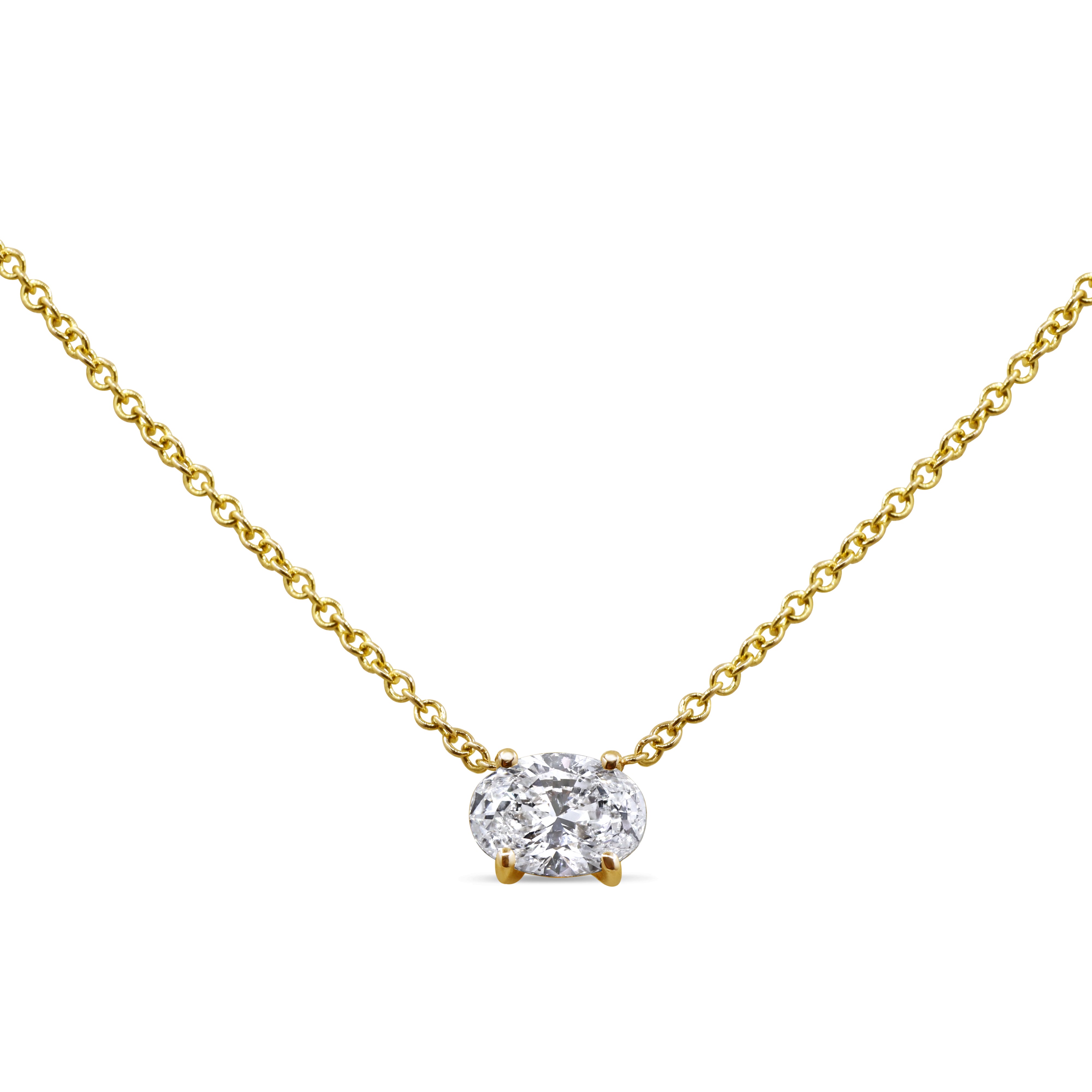East-west oval diamond pendant in 14K gold featuring a single prong-set diamond in a modern, elegant design.