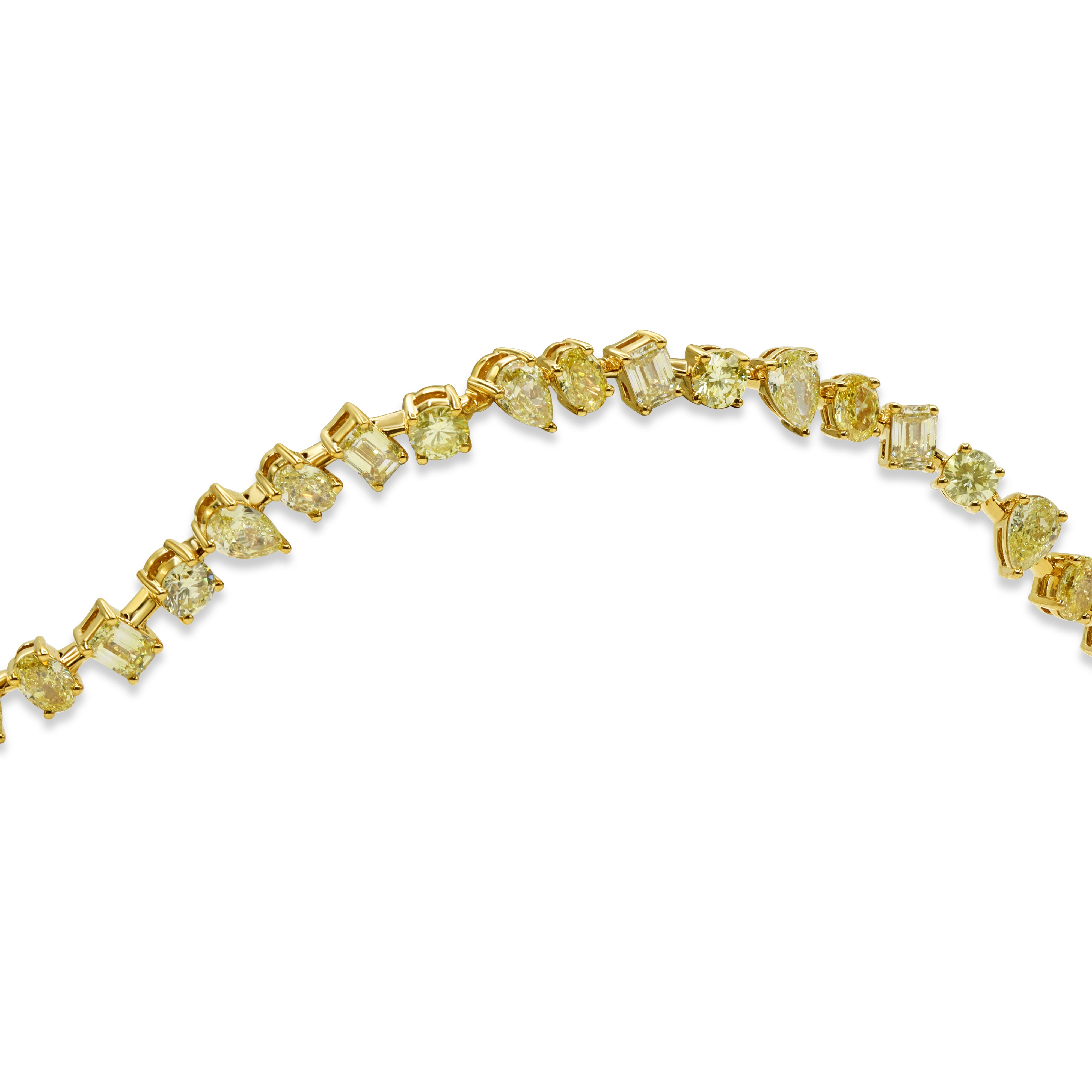 Multi-shape yellow diamond bracelet in 18K yellow gold featuring pear, emerald, and oval fancy yellow diamonds in an elegant statement design.