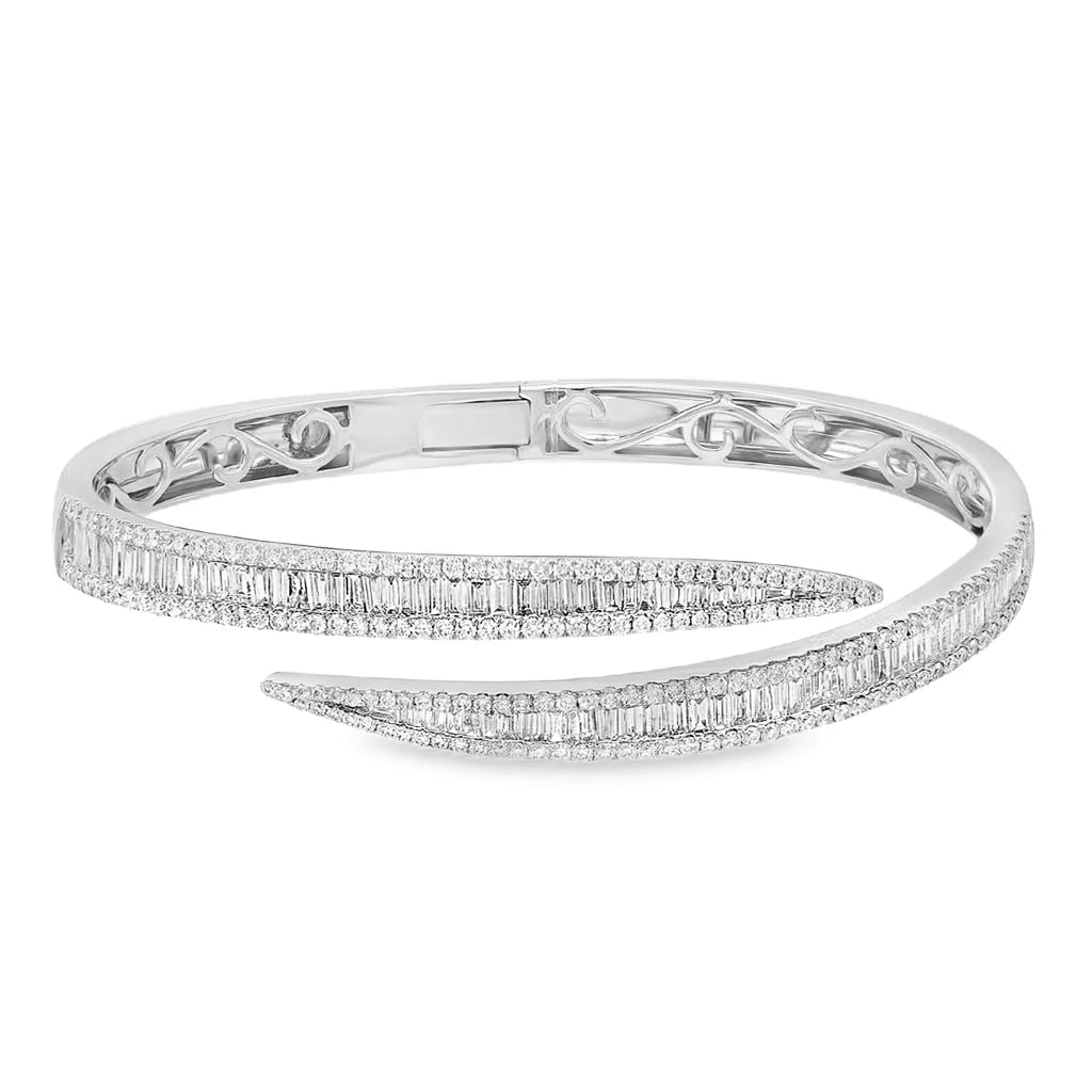 White gold bypass open bangle bracelet featuring three rows of natural round-cut and baguette diamonds totaling 4.06 CTW.
