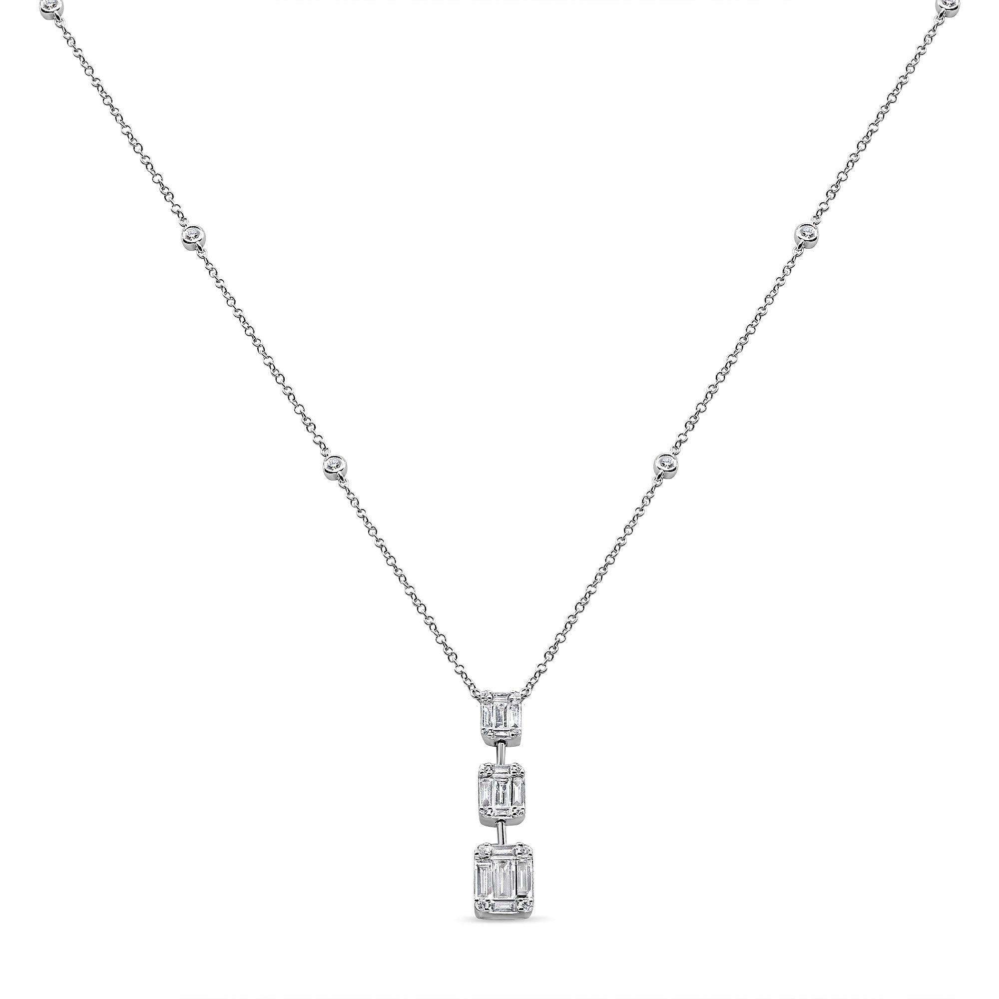 Graduated baguette and round diamond necklace in 14K gold featuring a vertical drop pendant with mixed-cut diamond detailing.