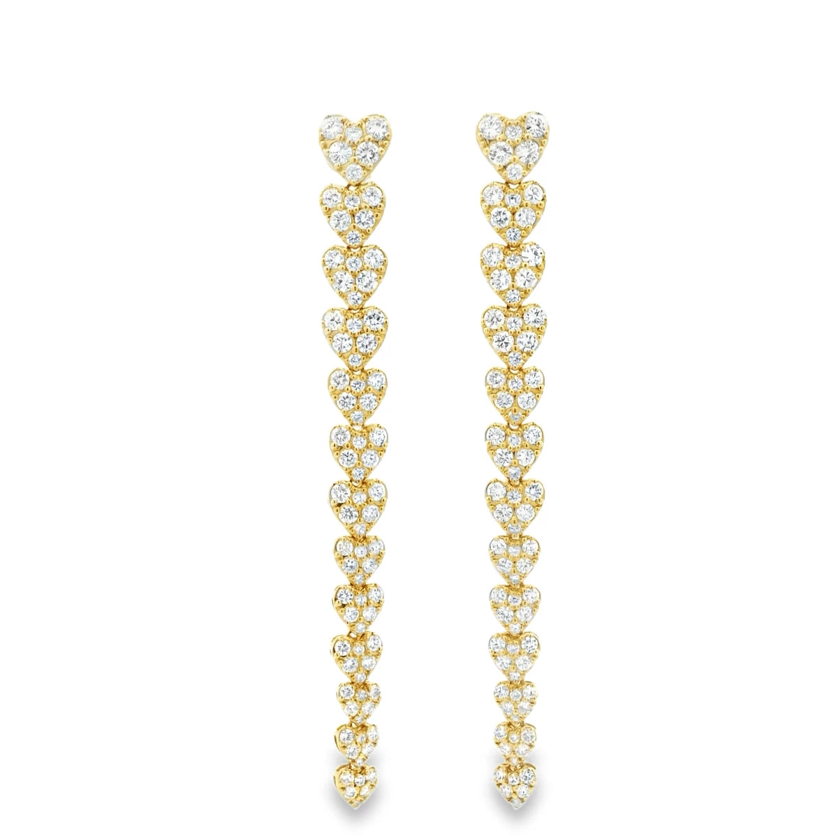Luxury heart diamond earrings showcasing brilliant heart-shaped diamonds in a long drop silhouette.