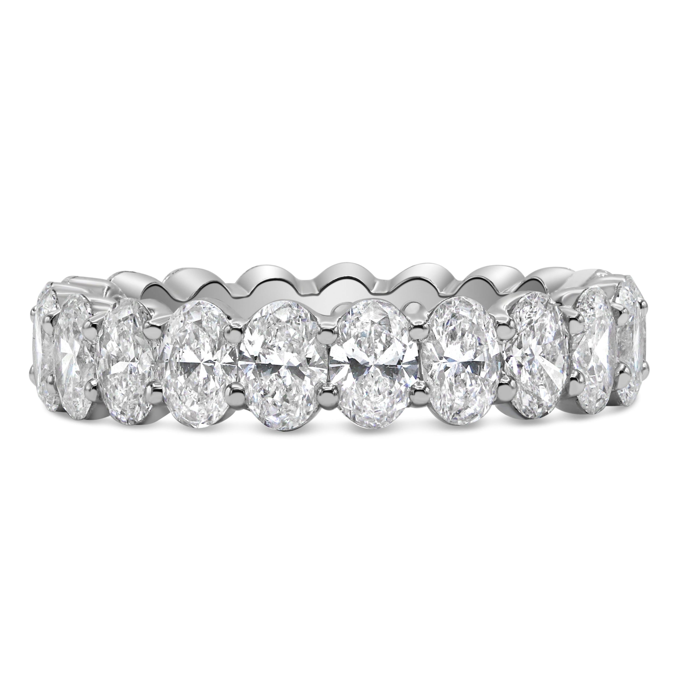 Lab grown oval cut diamond eternity band in 14K white gold featuring oval cut diamonds in a classic full eternity design.