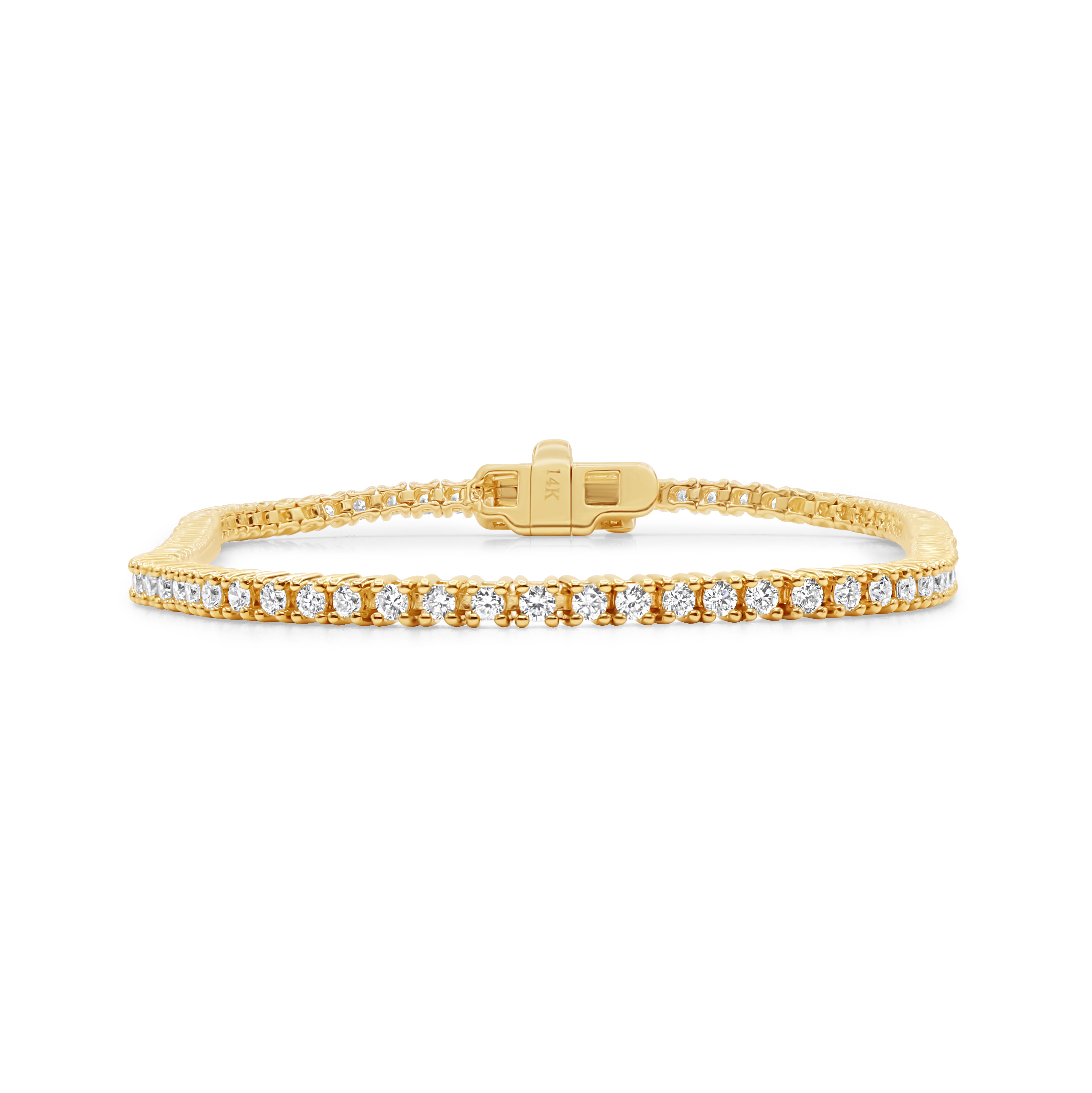 Delicate petite prong-set diamond tennis bracelet in 14K yellow gold with a 7-inch stackable design and 1.00 CT total weight.