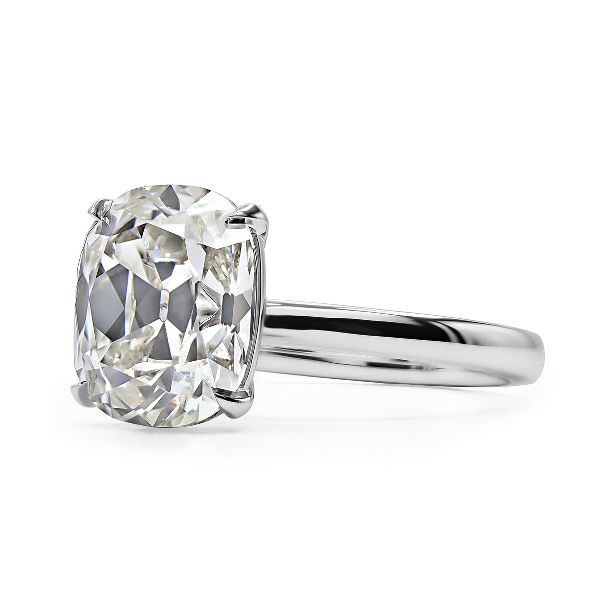 14K white gold solitaire ring with a 3.02 carat antique cushion diamond.