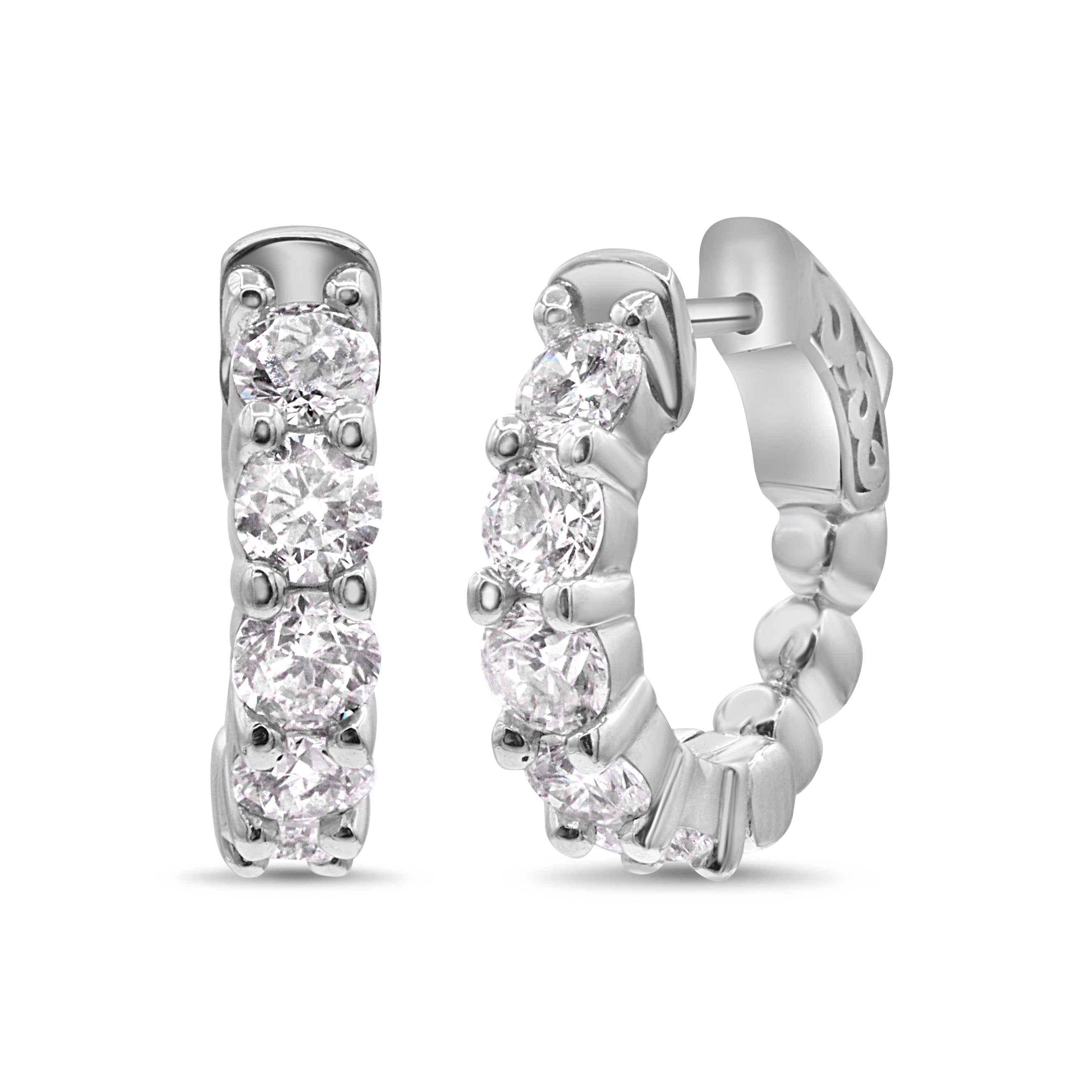 Large diamond huggie earrings in 14K white gold featuring round brilliant cut diamonds in a bold, glamorous hoop design.
