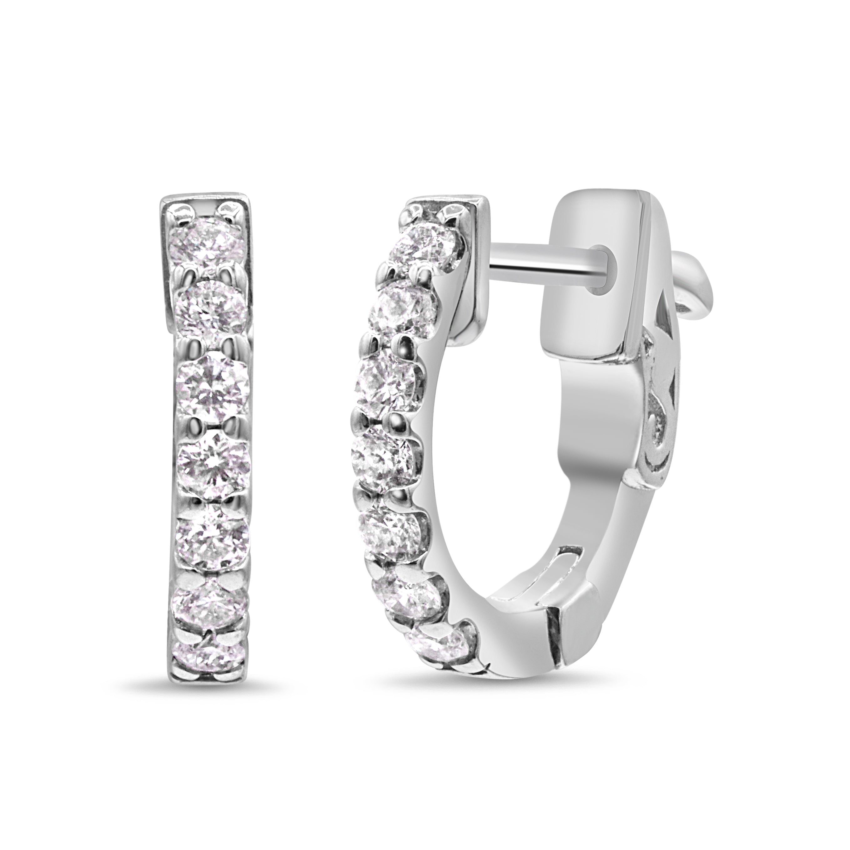 14K white gold diamond huggie earrings featuring round brilliant cut diamonds in a sleek, modern hoop design.
