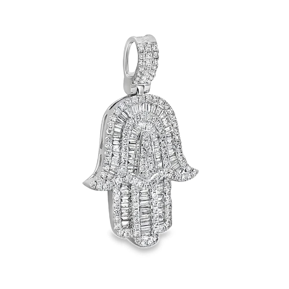 18K white gold diamond Hamsa pendant featuring round and baguette diamonds in a symbolic and elegant design.