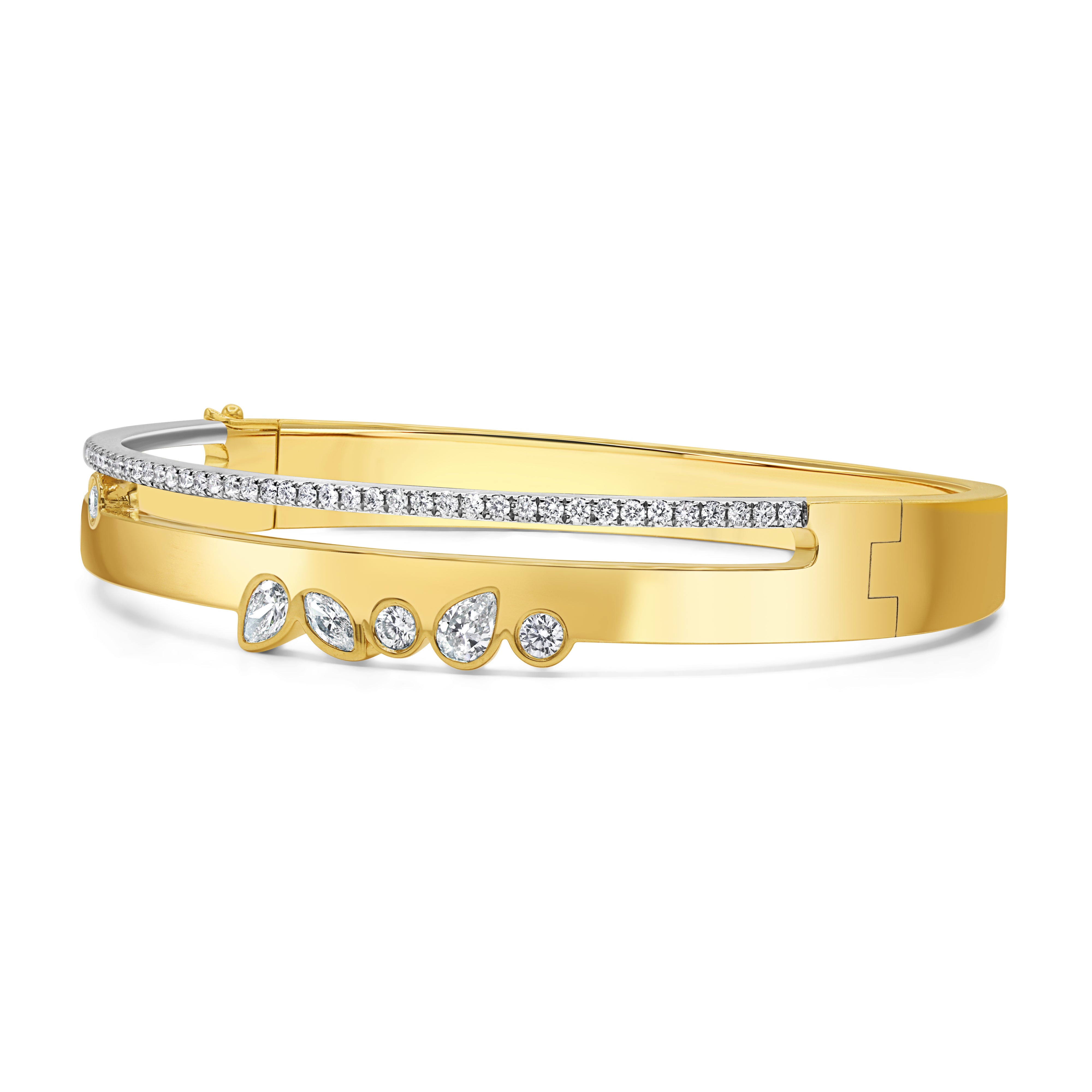 Bold diamond bangle in 18K two-tone gold featuring pavé and bezel-set natural diamonds in a modern statement design.