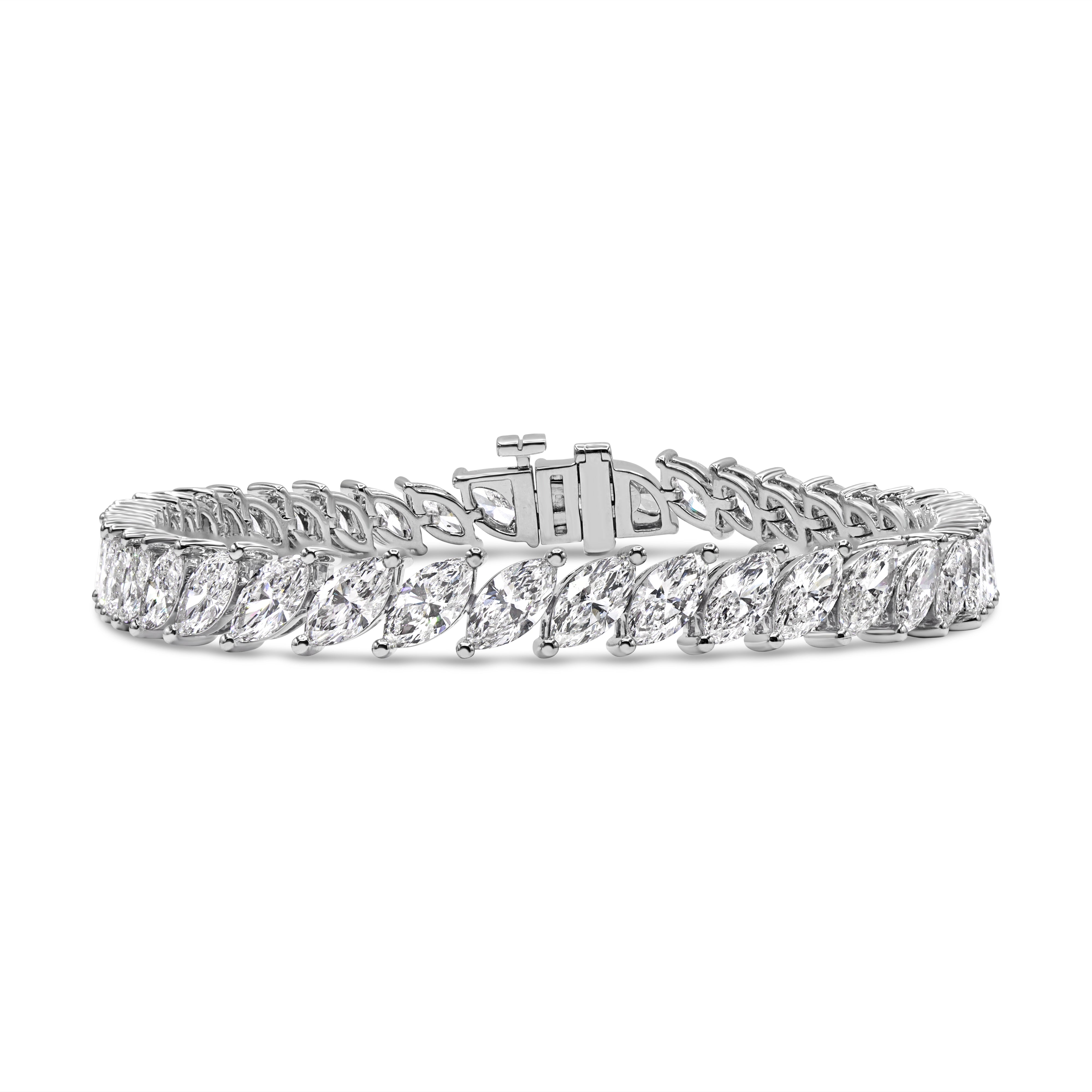 14K gold tennis bracelet featuring slanted marquise-cut diamonds in a seamless and elegant setting.