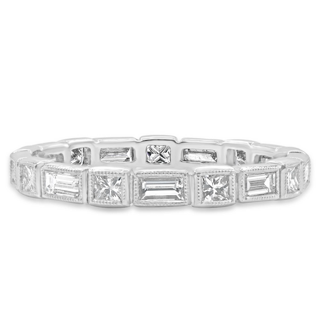 14K gold diamond band featuring 9 princess cut diamonds and 9 baguette cut diamonds, totaling 0.90 CTW, in alternating bezel settings with milgrain detailing.