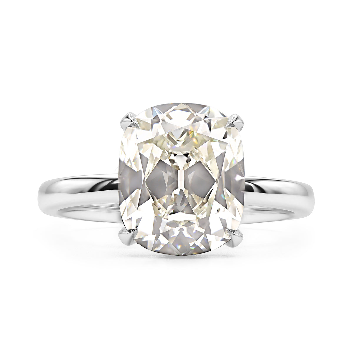 14K white gold antique cushion solitaire ring featuring a 3.02 carat J VS1 antique cushion diamond.