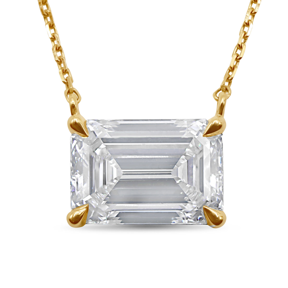 14K yellow gold pendant with a 2.01 carat emerald cut diamond in an east-west setting.