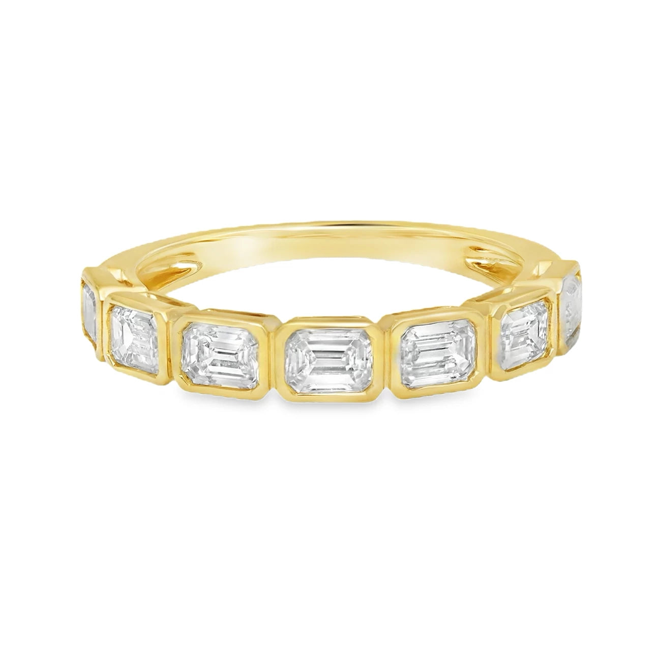 18K yellow or white gold band featuring emerald cut diamonds with approximately 1.19 carats total weight in a half bezel east-west setting.