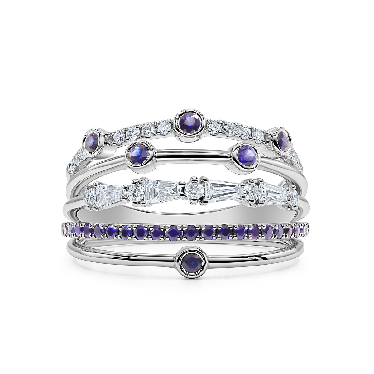 18K gold orbit ring featuring 27 blue sapphires, 4 baguette diamonds, and 19 round diamonds totaling 0.74 CTW in a five-row layered design.