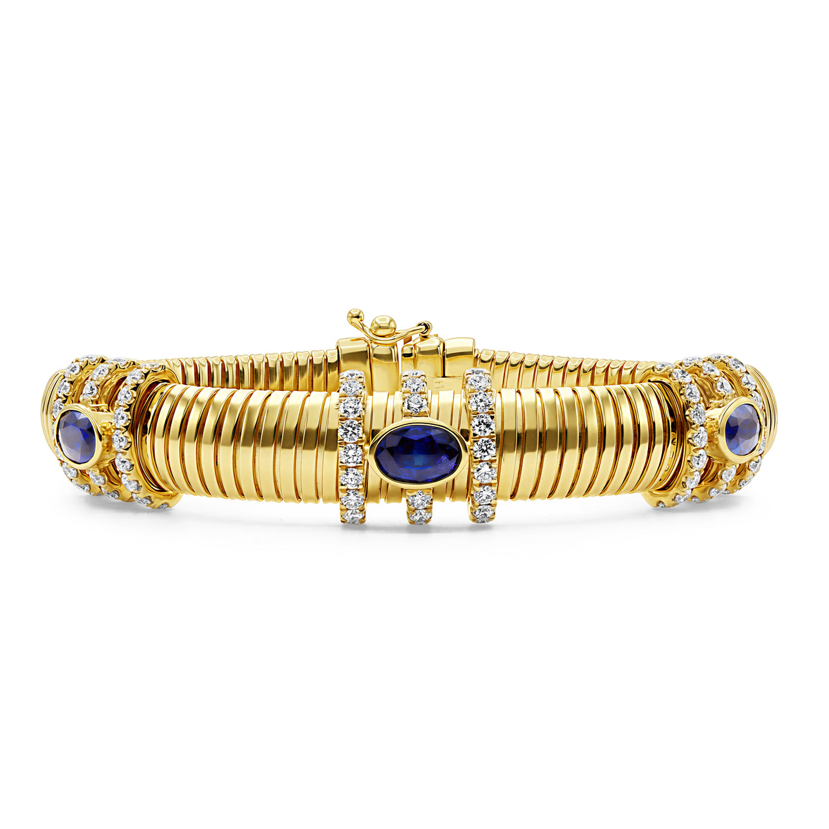 18K gold chunky bracelet featuring 3 blue sapphires totaling 1.78 CTW and 72 round diamonds totaling 1.29 CTW in bezel and pavé settings.