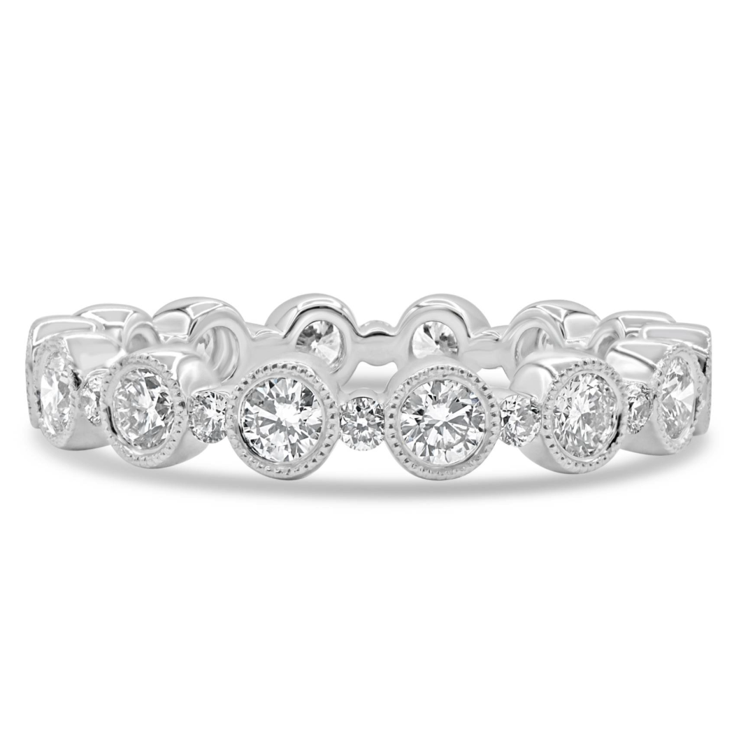 18K gold bubble band featuring 27 round brilliant diamonds totaling 0.50 CTW in alternating bezel and prong settings.