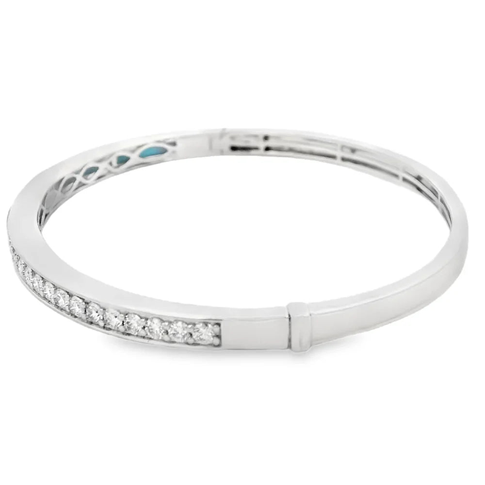 18K diamond and turquoise bangle bracelet featuring diamond accents and vibrant turquoise inlays in a modern two-tone gold design.