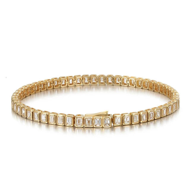 18K yellow gold emerald cut diamond bracelet with bezel-set diamonds totaling 5.70 carats.