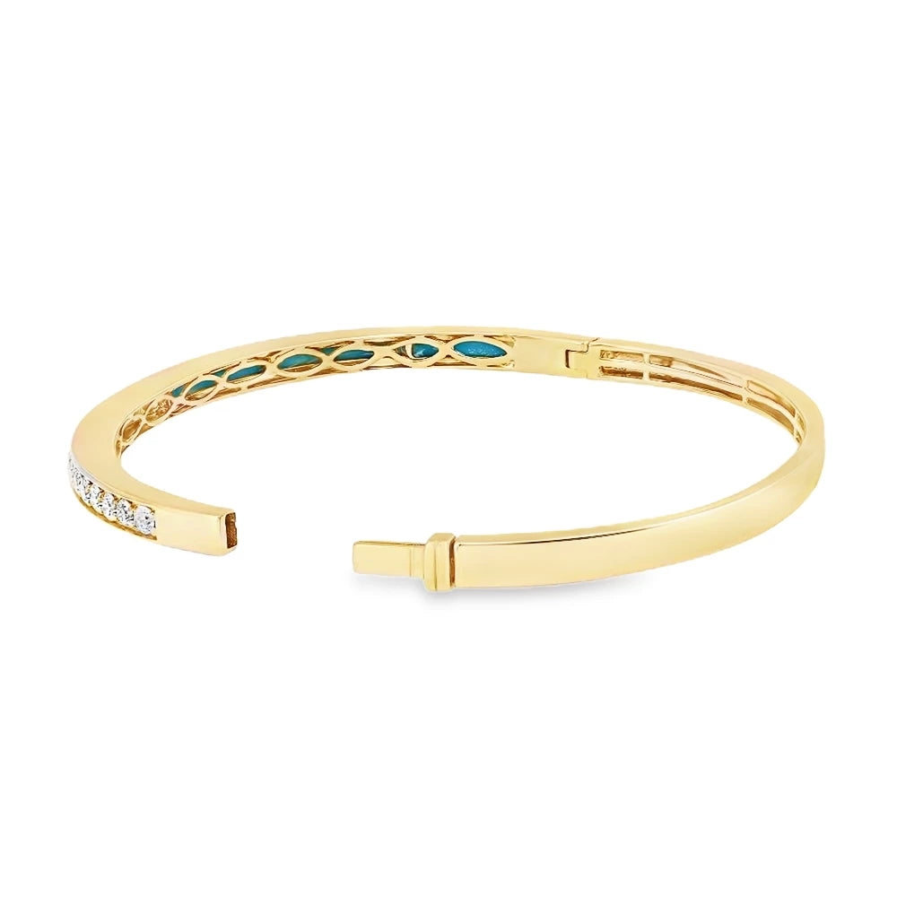 Diamond and turquoise bangle crafted in 18K yellow and white gold with a modern design.