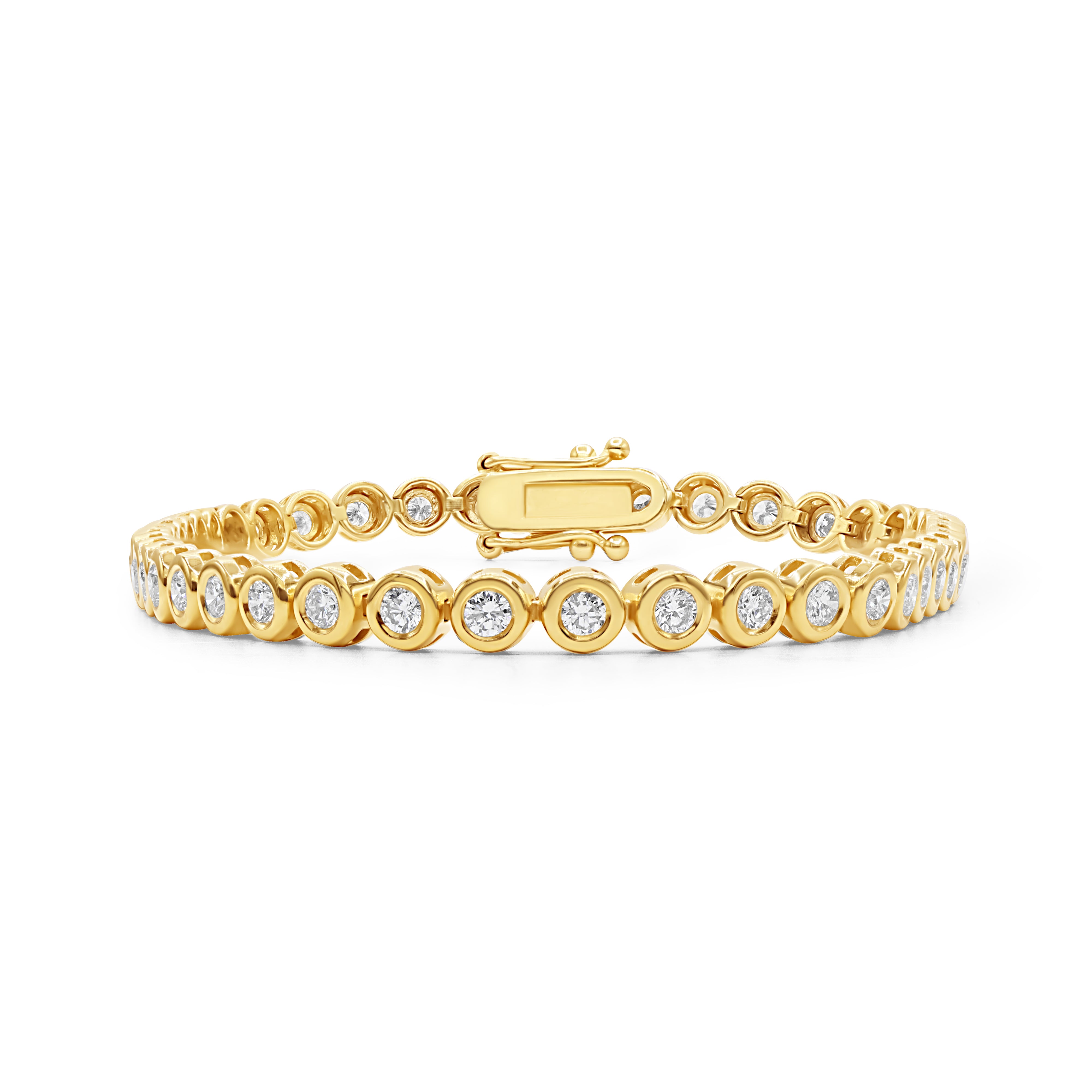 Round cut diamond tennis bracelet in 14K or 18K gold featuring bezel-set diamonds in a timeless, elegant design.