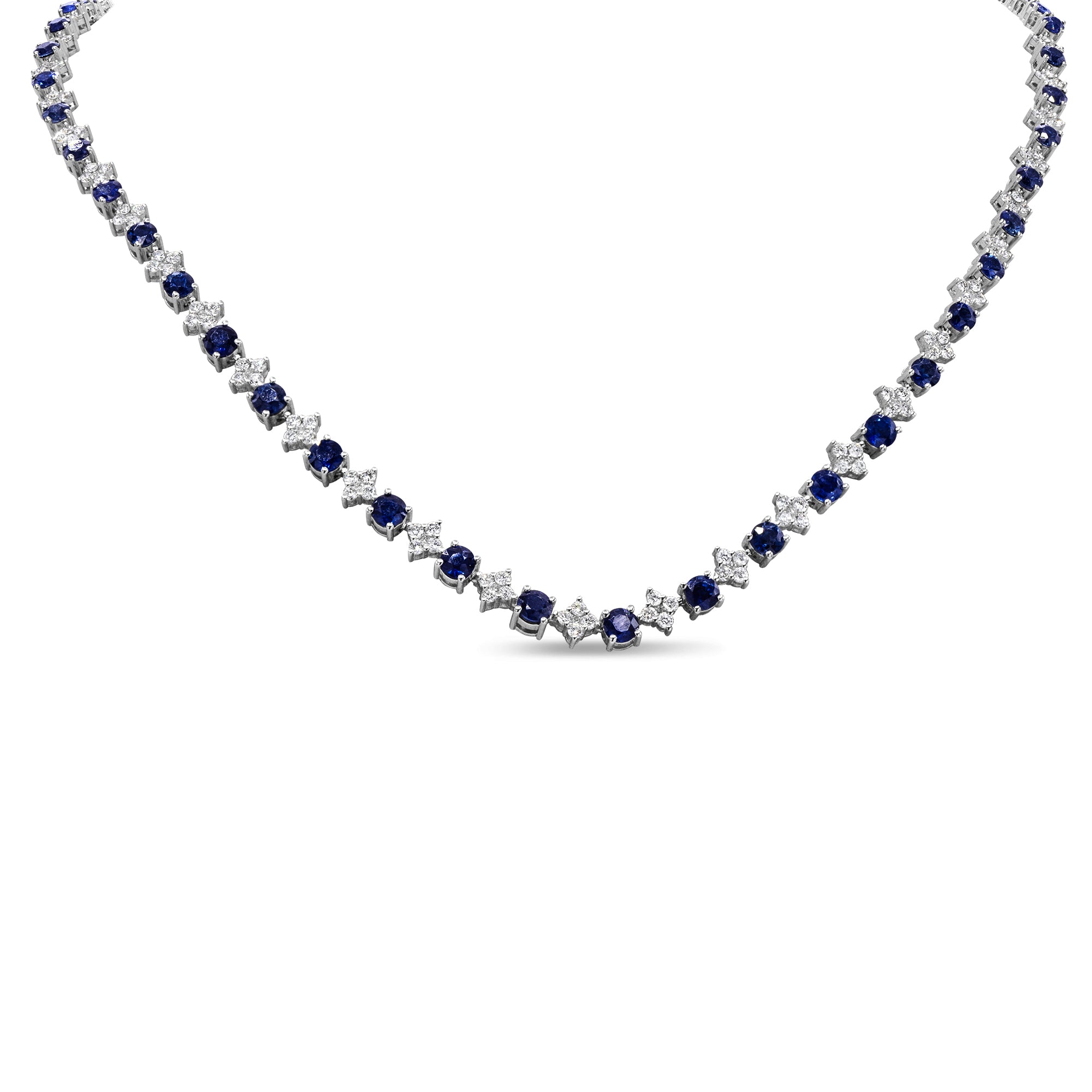 Elegant sapphire and diamond necklace with prong-set blue sapphires and round brilliant diamonds.
