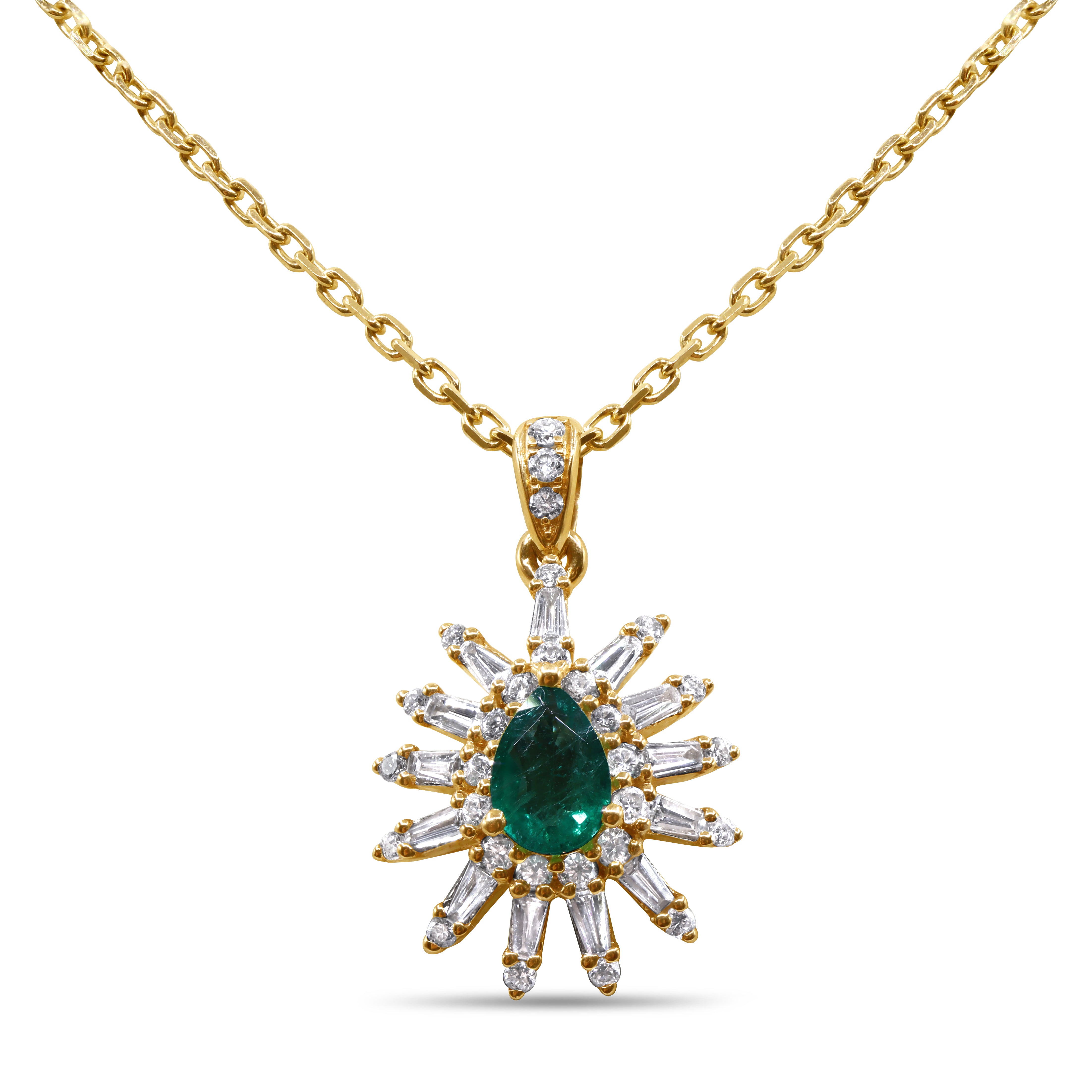 Green emerald and diamond pendant in 14K gold featuring a natural emerald center with baguette and round diamond accents in a luxurious design.