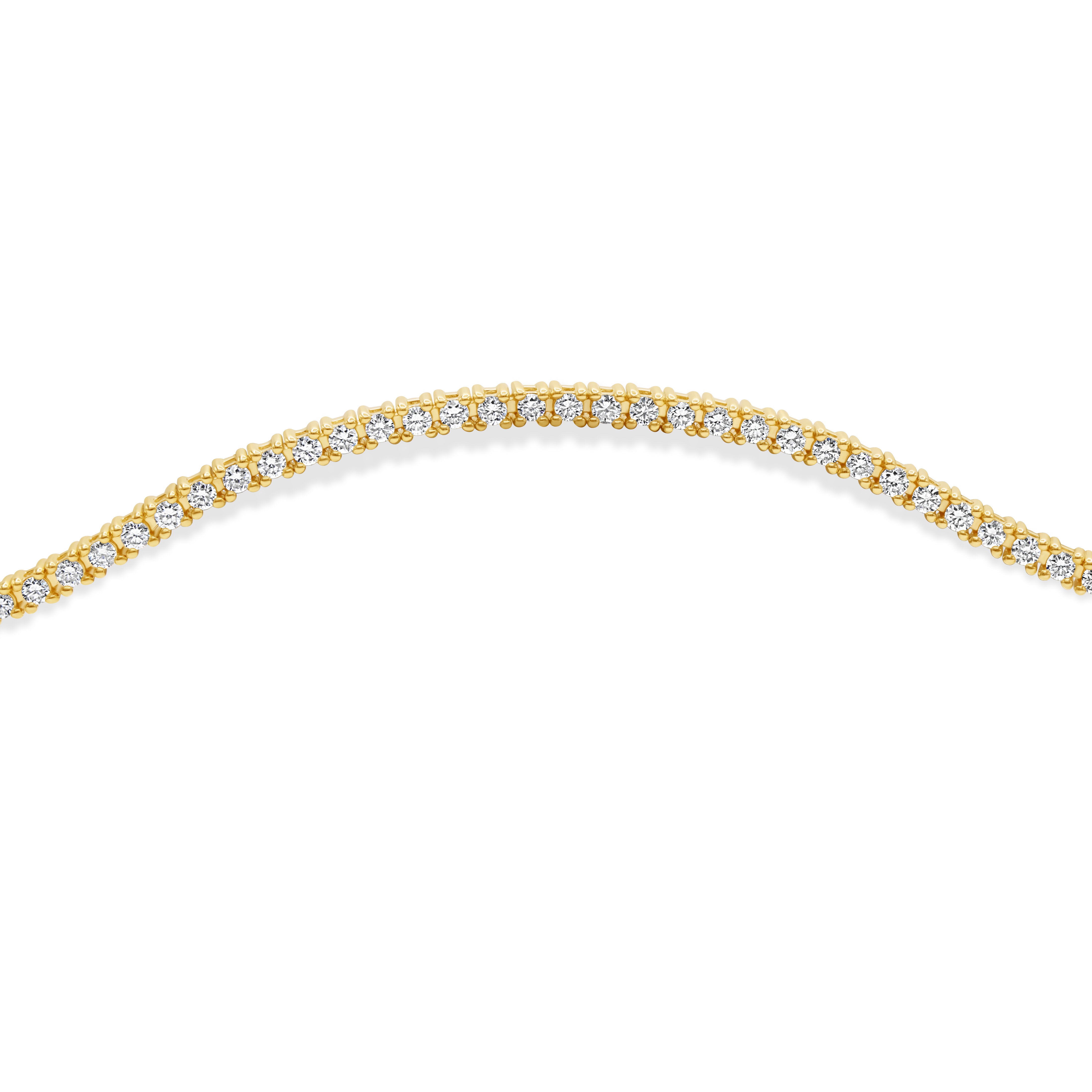 Petite prong-set round cut diamond tennis bracelet in 14K yellow gold featuring a delicate, classic, and stackable 7-inch design with 1.00 carat total diamond weight.