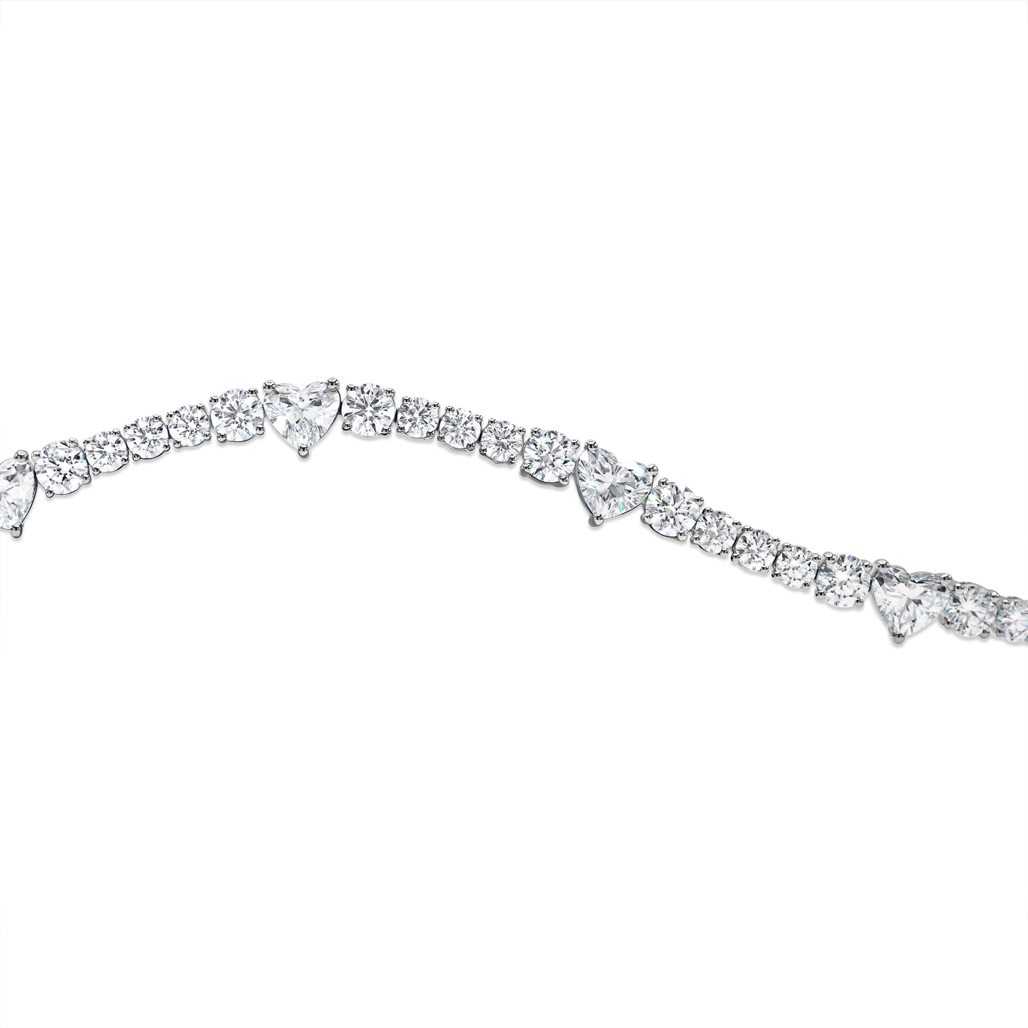 Round and heart shape diamond bracelet in 14K gold featuring alternating prong-set diamonds in a romantic, luxurious design.
