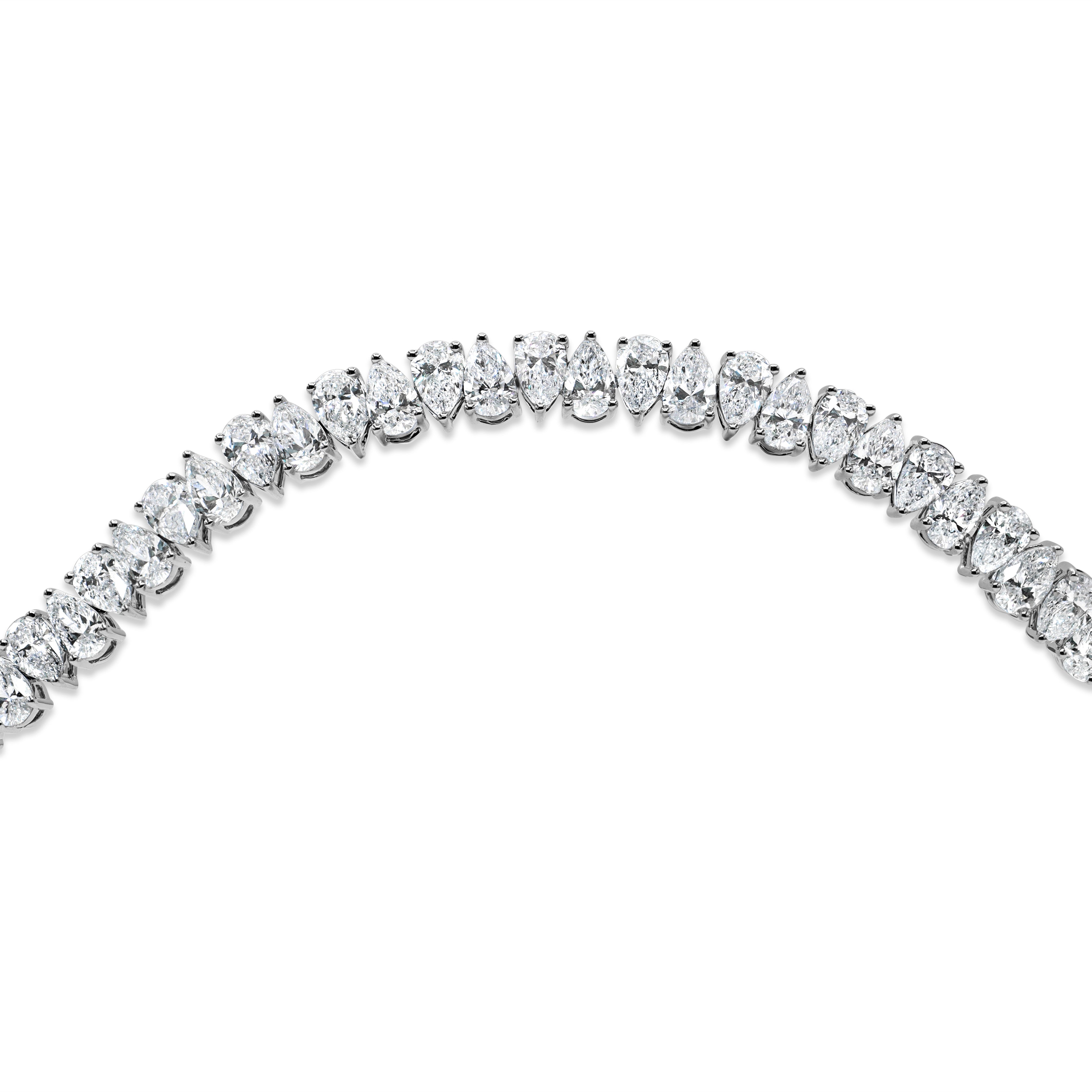 Side-to-side pear diamond tennis bracelet in 14K gold featuring lab-grown pear-shaped diamonds in a fluid, elegant design.