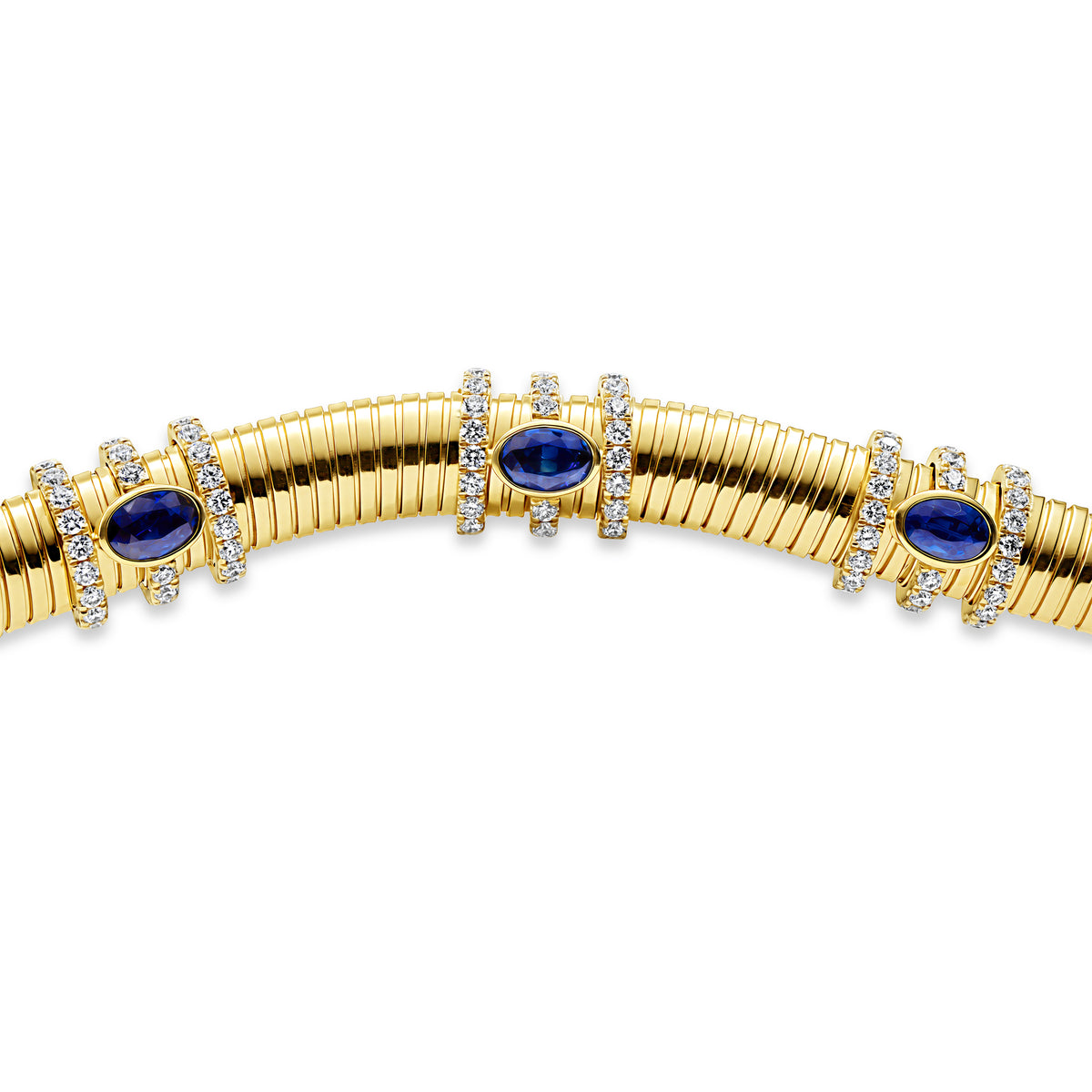 18K gold chunky bracelet with blue sapphires set in bezels and round diamond accents.