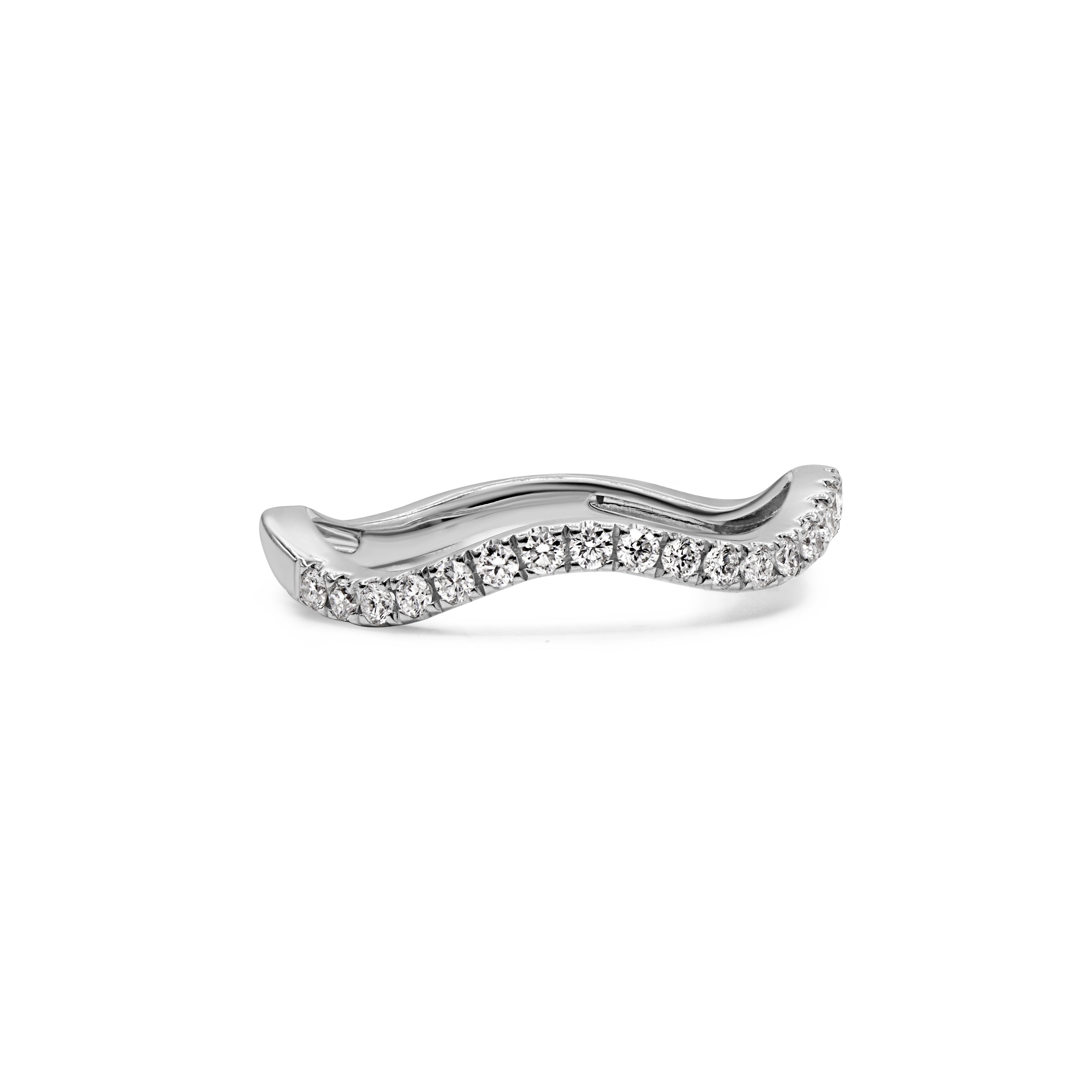 Modern diamond ring with a flowing wave silhouette crafted in 14K gold.