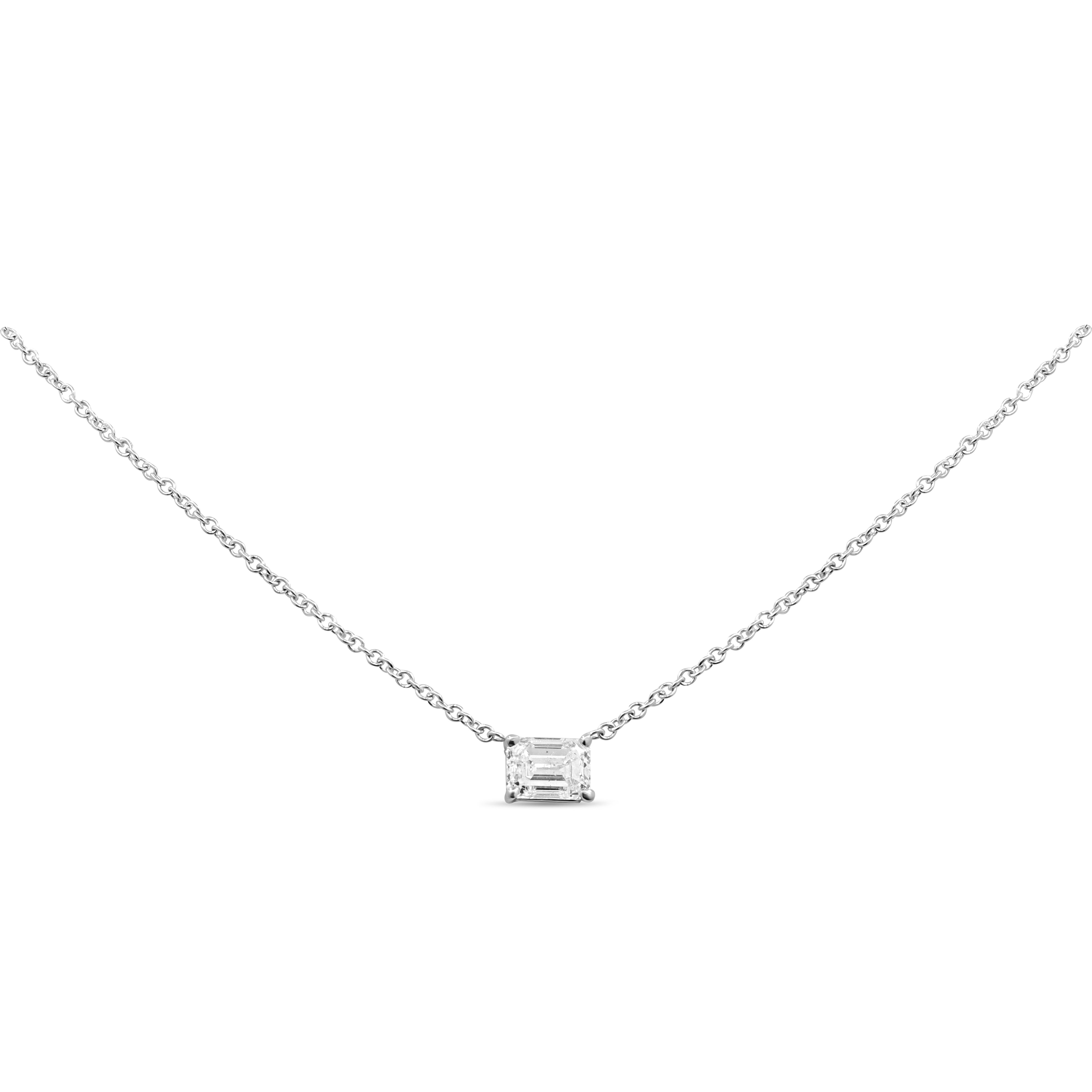 East-west emerald cut diamond pendant in 14K gold featuring a single prong-set diamond in a modern, timeless design.