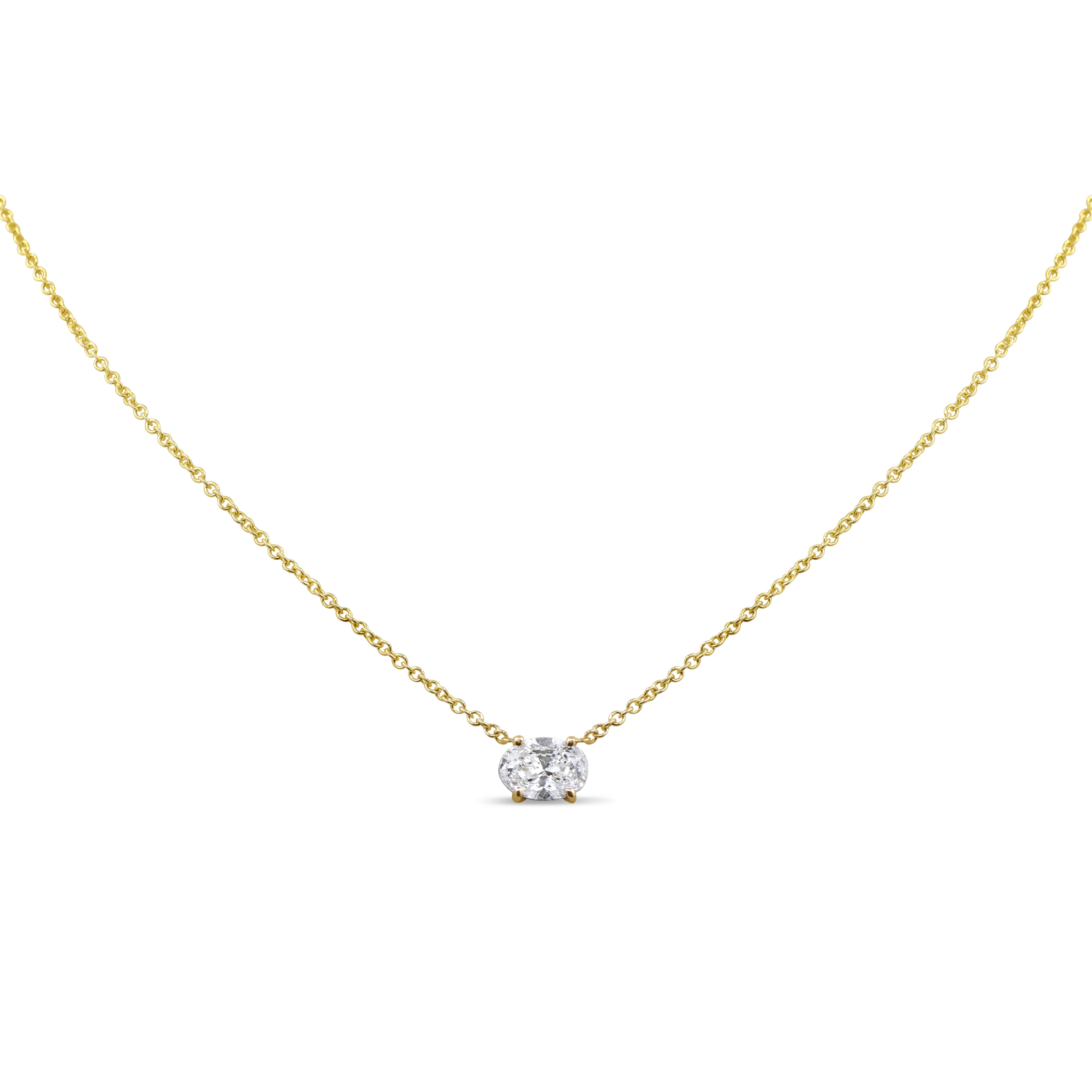 14K gold pendant featuring a single east-west oval diamond in a sleek prong setting.