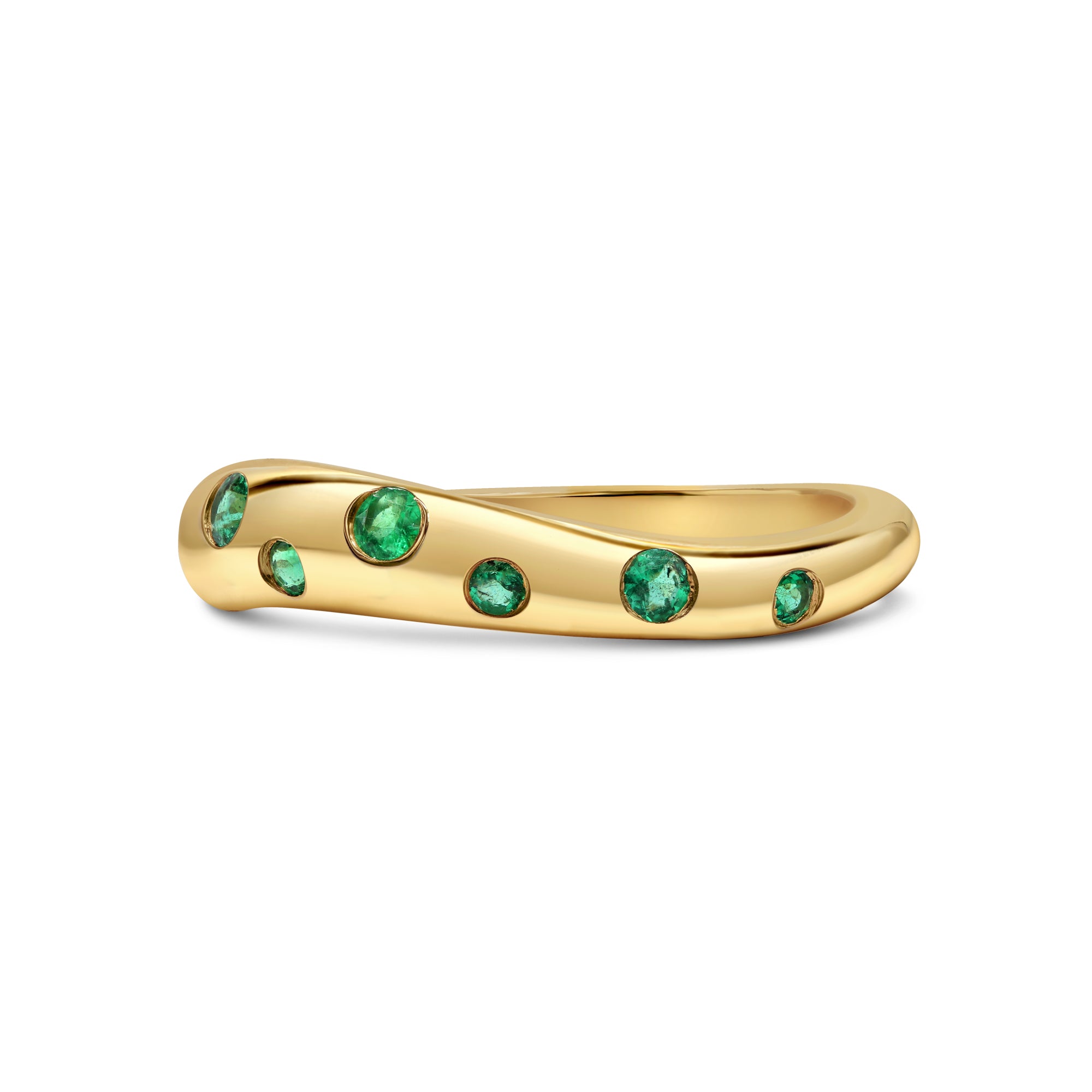 18K gold curved ring featuring bezel-set green emeralds in a smooth, modern inlay design.