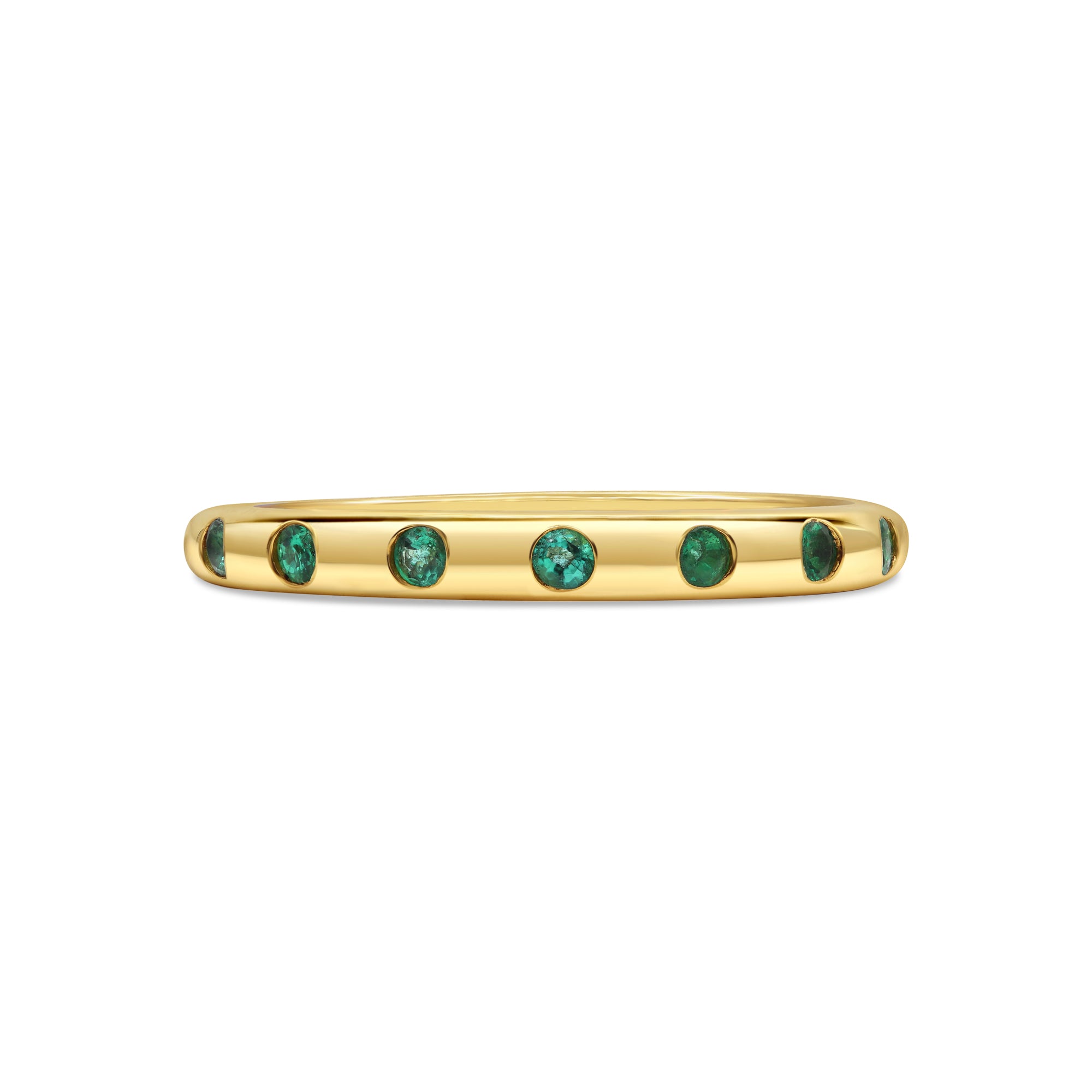 Green emerald inlay ring in 18K gold featuring evenly spaced round emeralds in a sleek, modern stacking design.