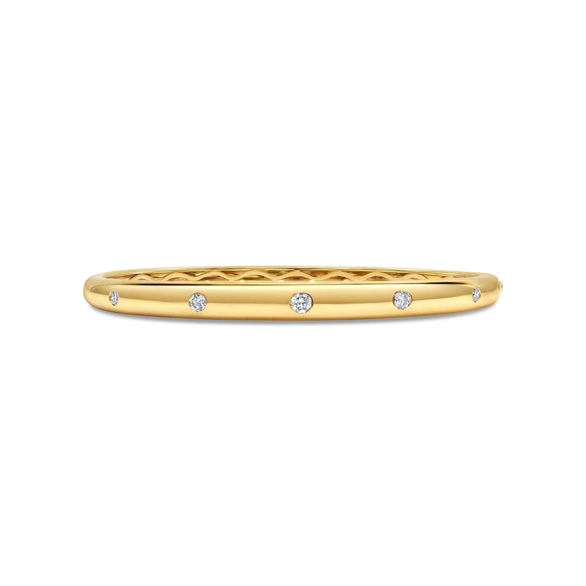 14K gold slim bangle featuring round brilliant diamonds in a refined bezel-style inlay setting.
