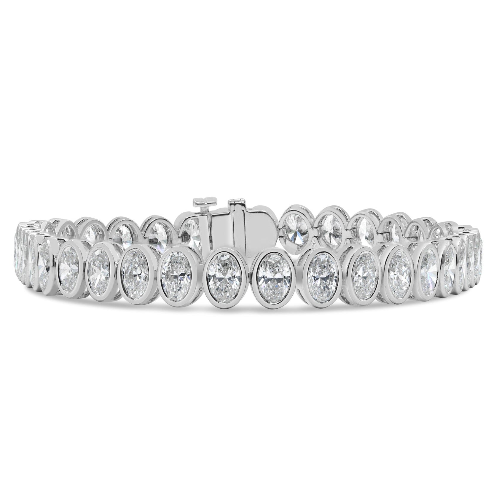 Lab grown bezel oval cut diamond tennis bracelet in 14K white gold featuring oval cut diamonds in a sleek bezel-set design.
