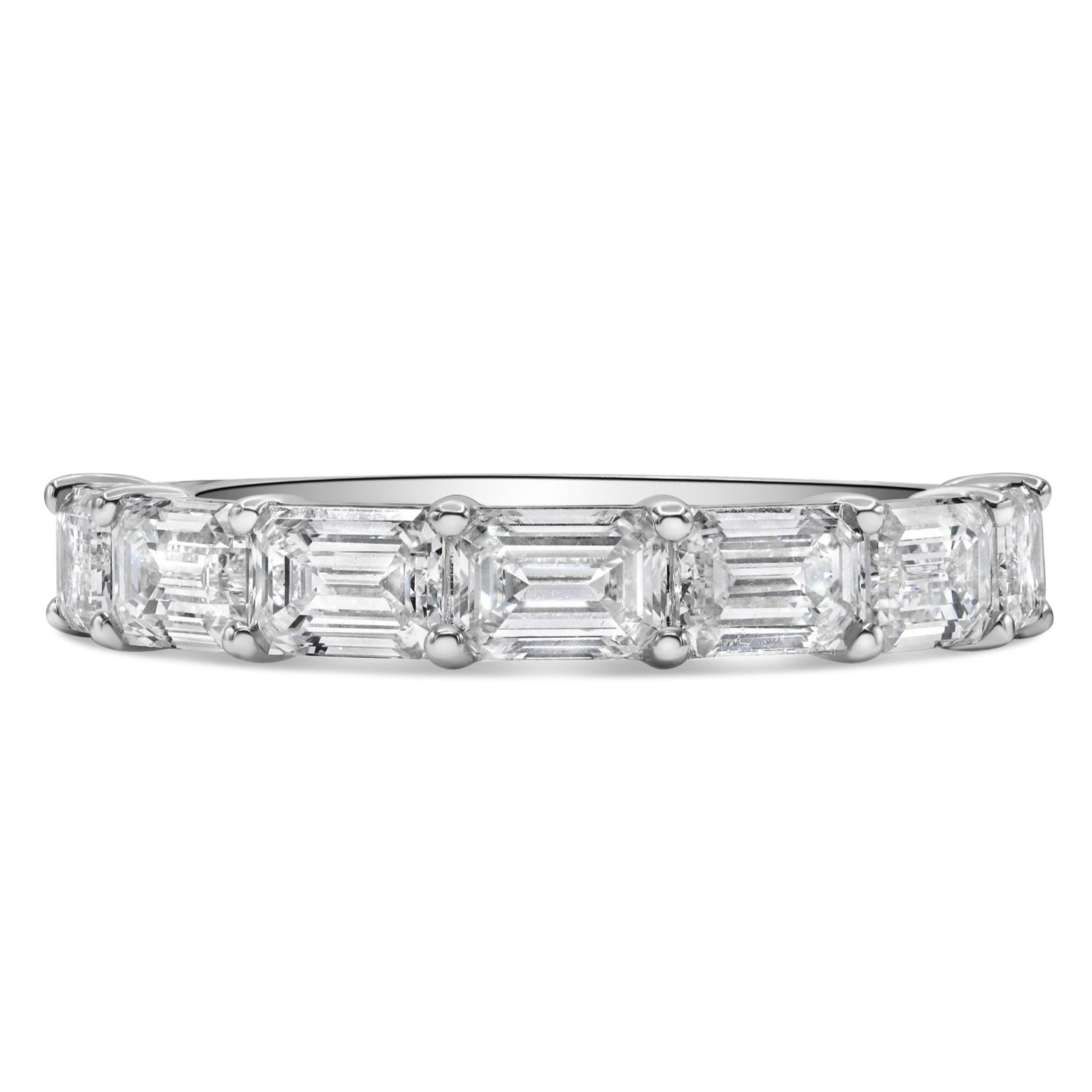 14K white gold band featuring east-west set lab grown emerald cut diamonds with E-F color and VS1 clarity.