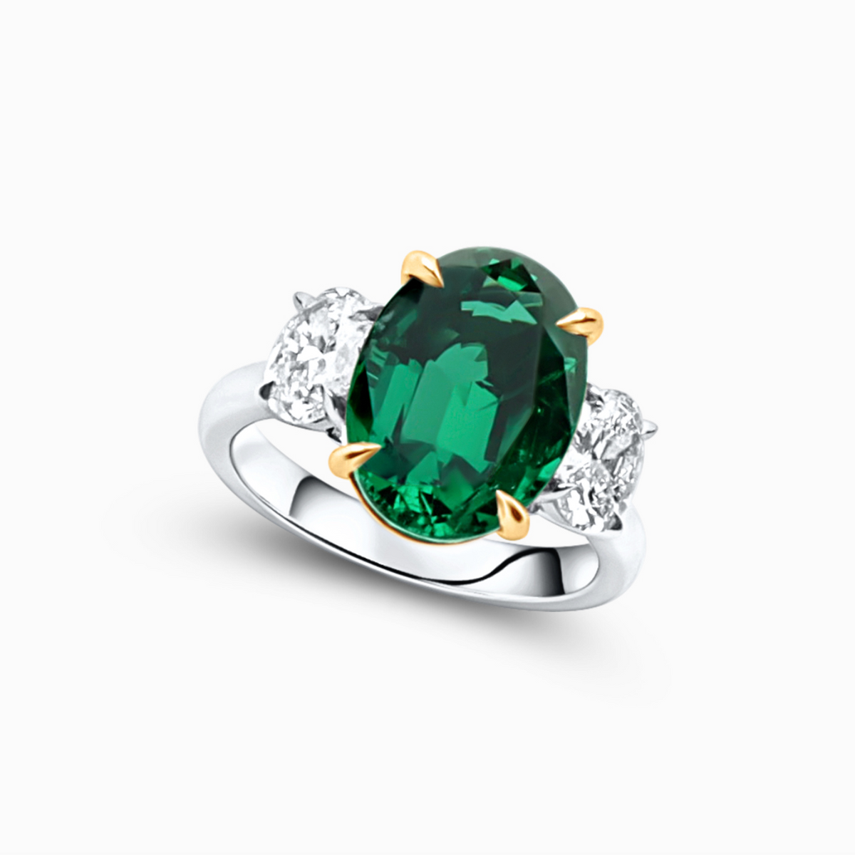 Oval emerald and diamond ring featuring a 4.44 carat emerald with a 1.09 carat F-G color VS2 oval diamond.