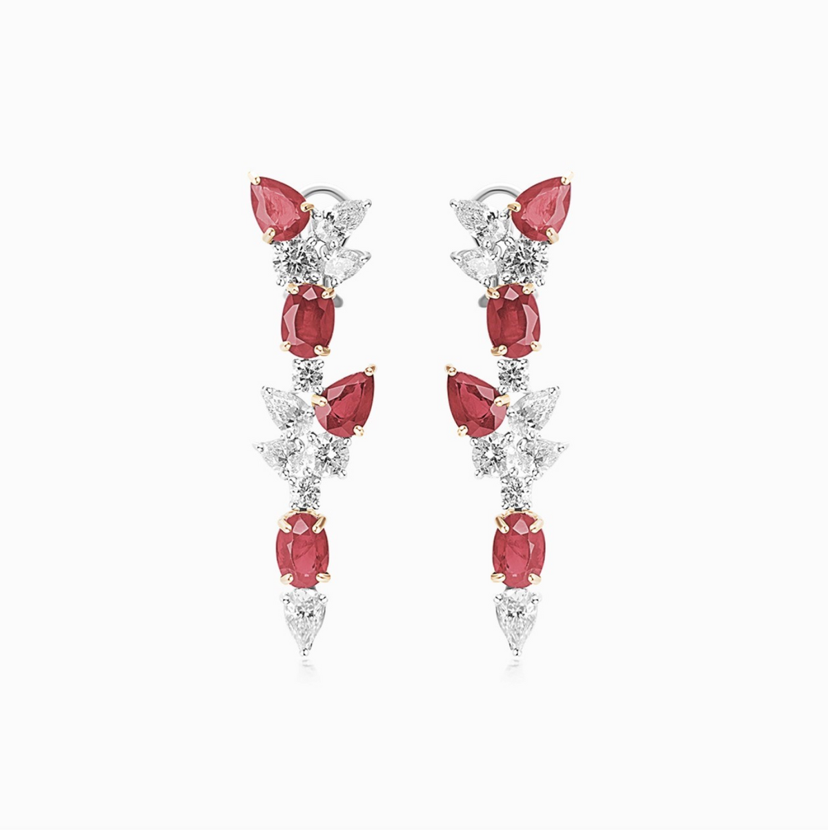 Platinum and 18K yellow gold diamond and ruby drop earrings featuring an elegant fancy design.
