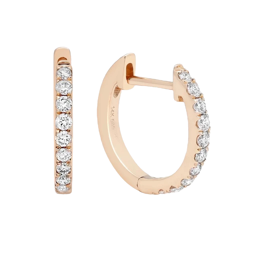 Petite diamond huggie earrings in 14K yellow and white gold featuring sparkling diamonds in an elegant everyday hoop design.